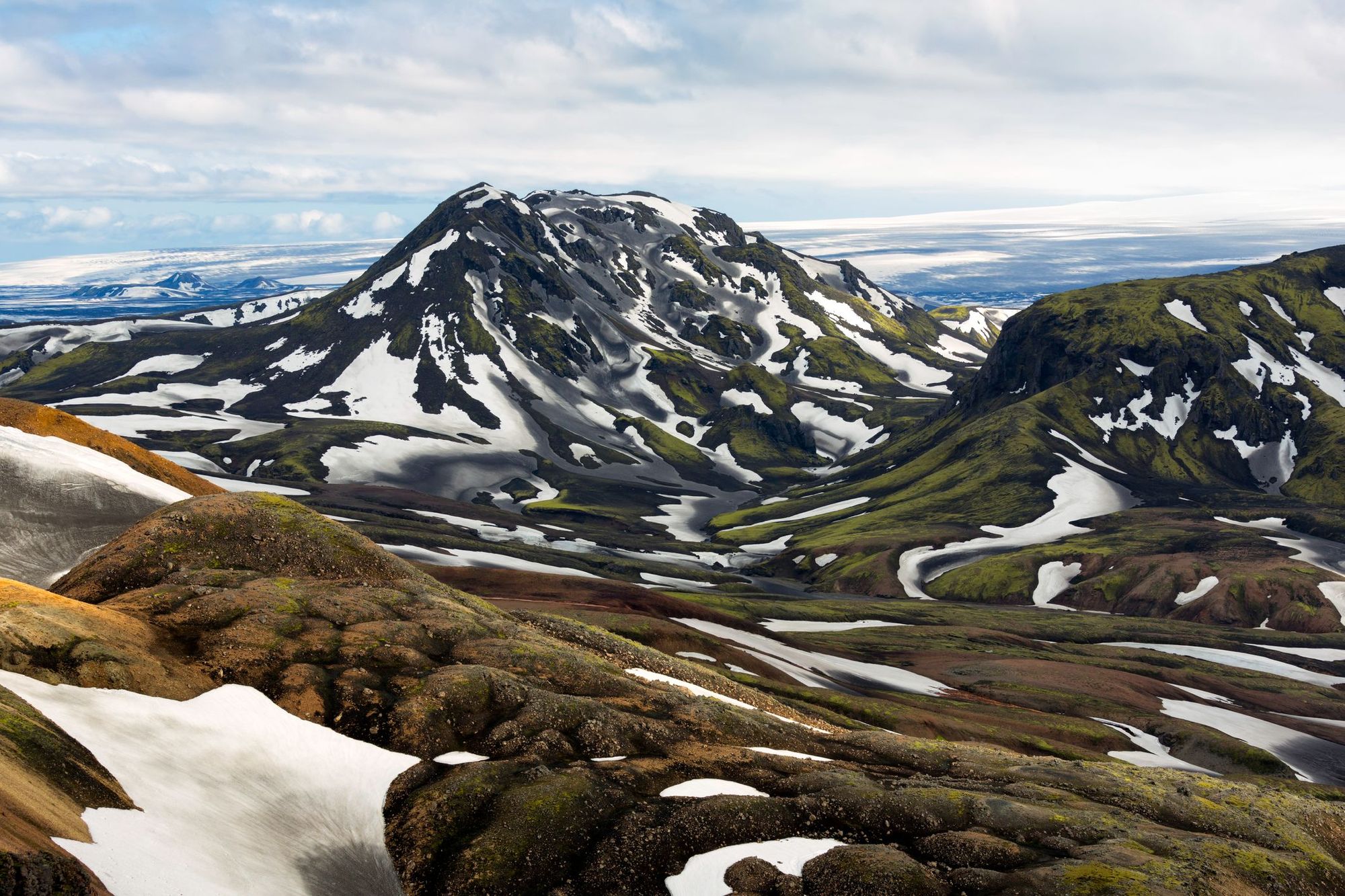 The striking, snow-streaked mountains of Iceland's Laugavegur Trail