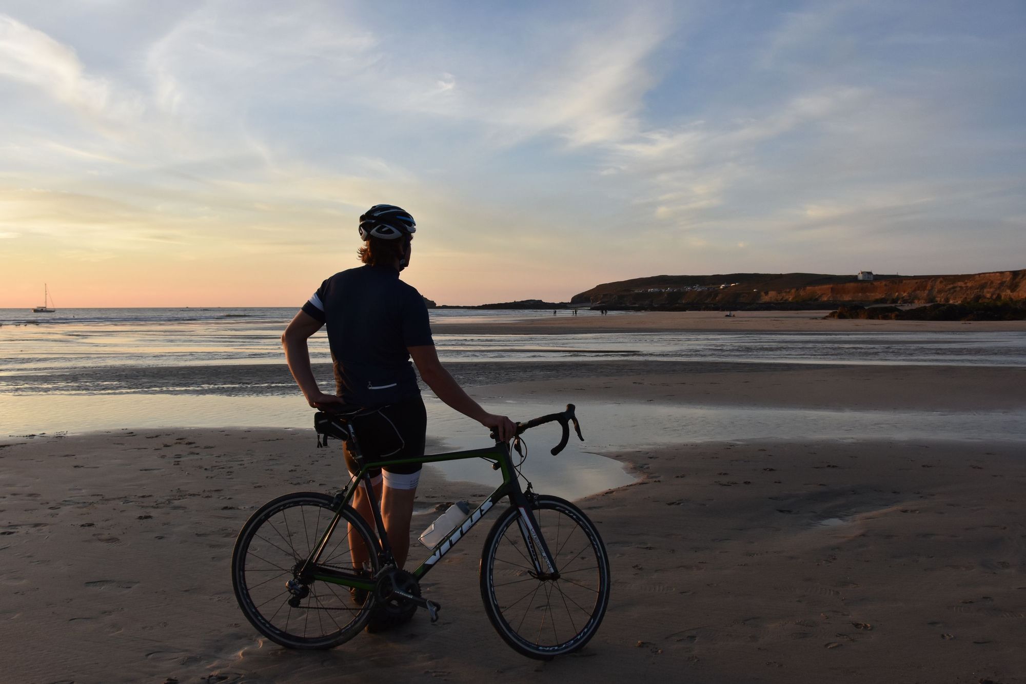 Cyclist John Hughes looking out on the north coast of Cornwall. Photo: Hannah Reynolds.