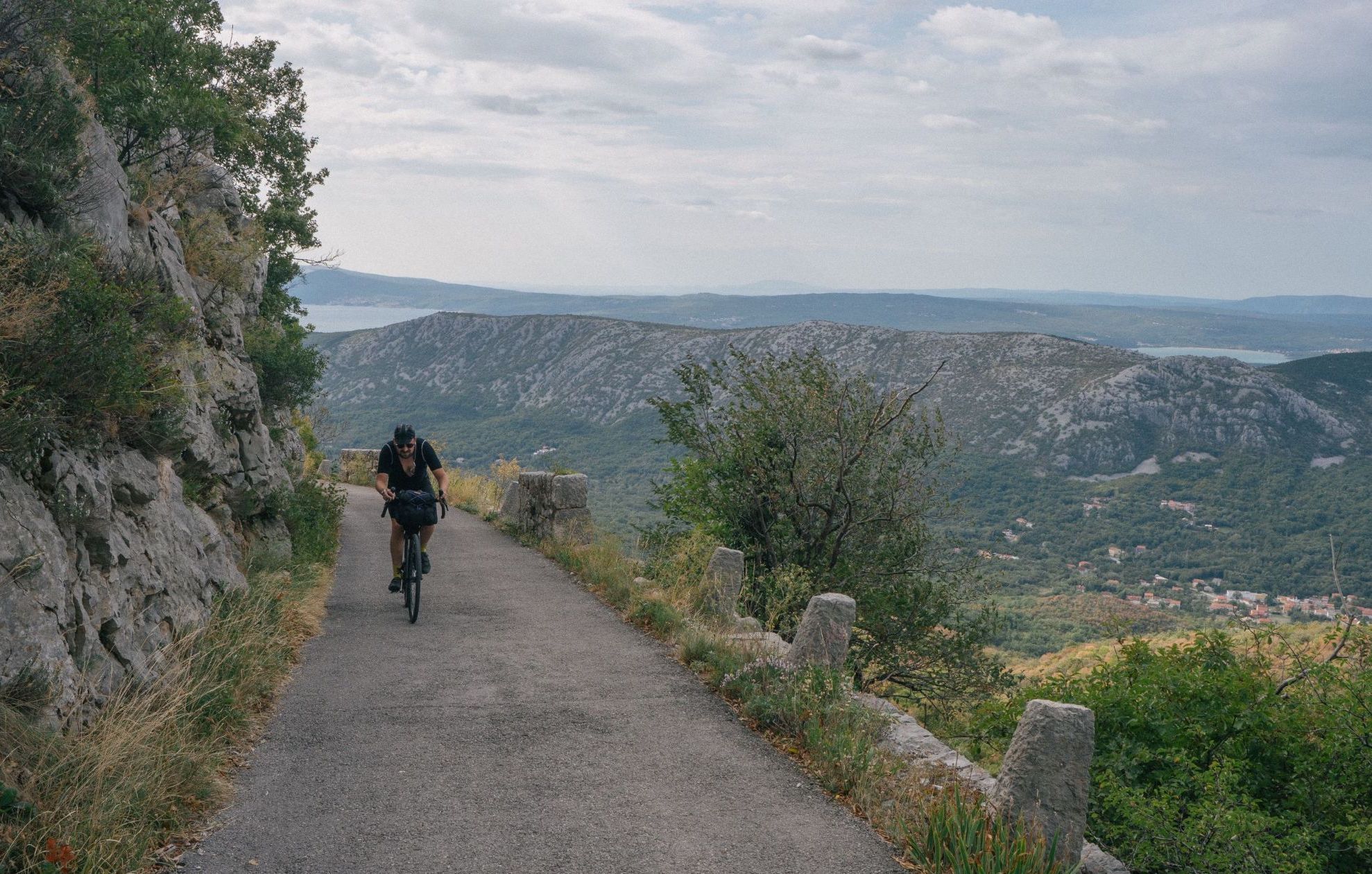Jon Hickens of Restrap makes his way up a scenic climb on a bikepacking adventure in Croatia. Photo: Restrap