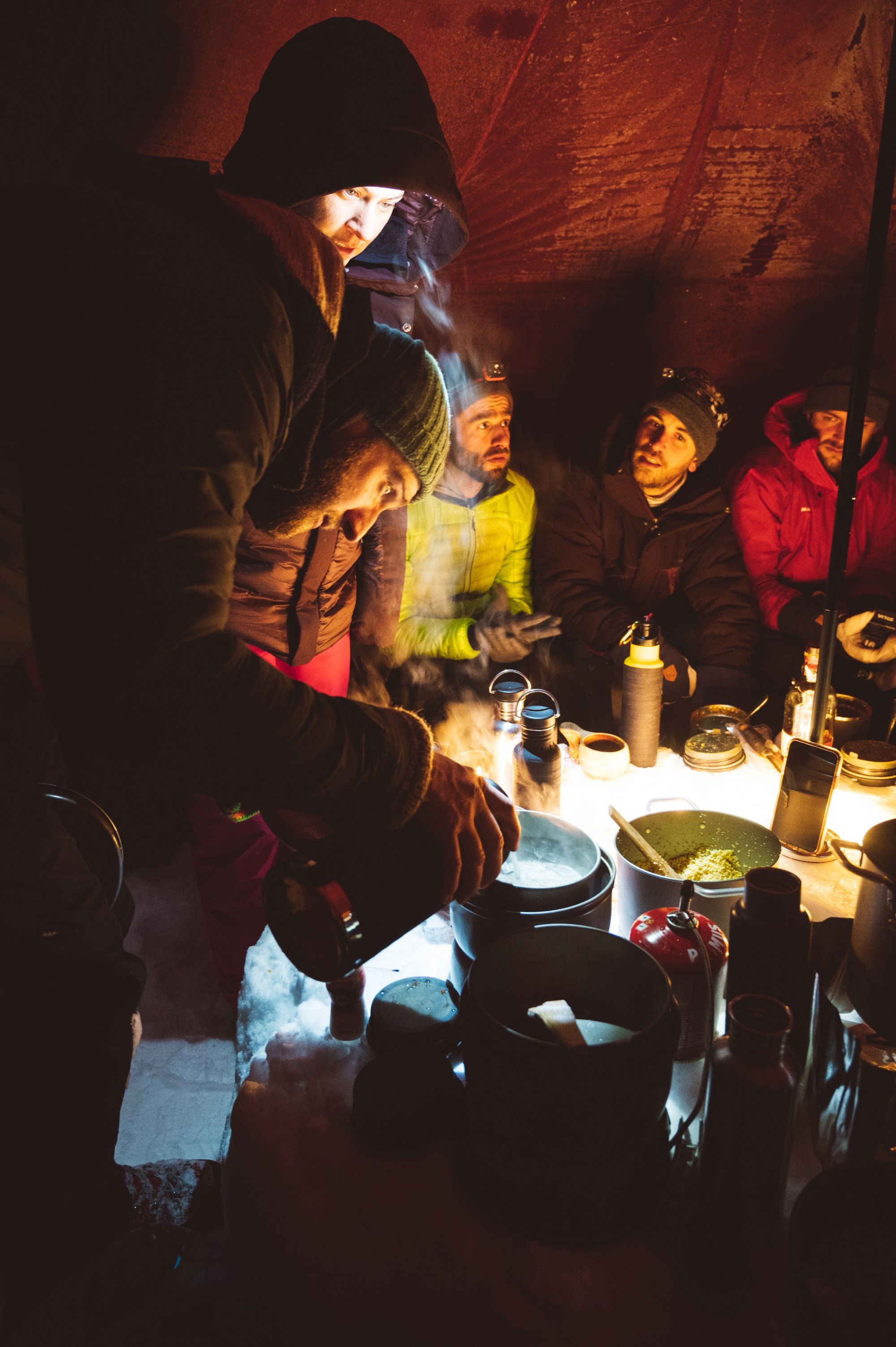 A group wait for their guide to serve up coffee after a day exploring in the Swedish snow. Photo: Do the North