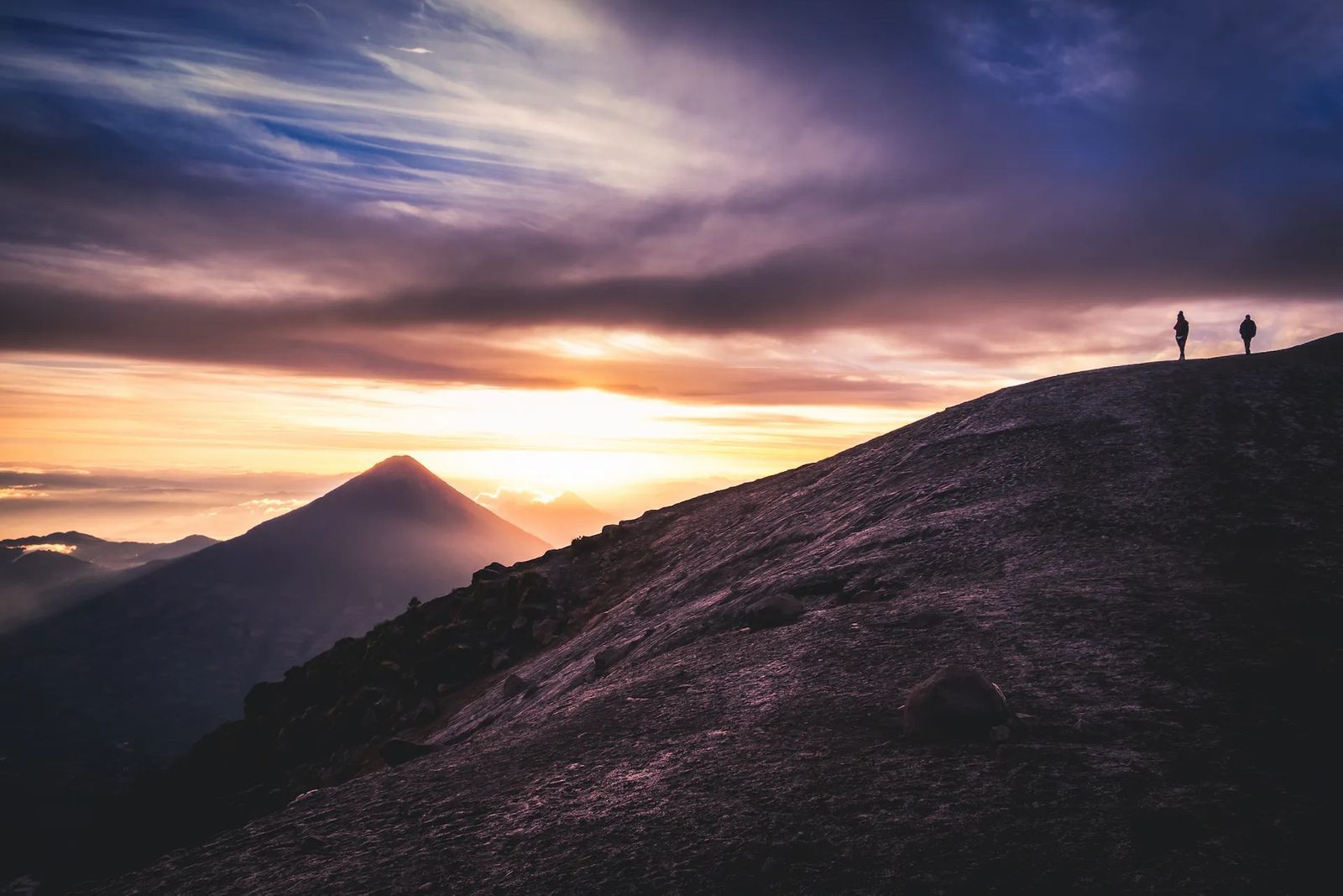 Hikers watch sunrise from the top of Acatenango, an active volcano in Guatemala