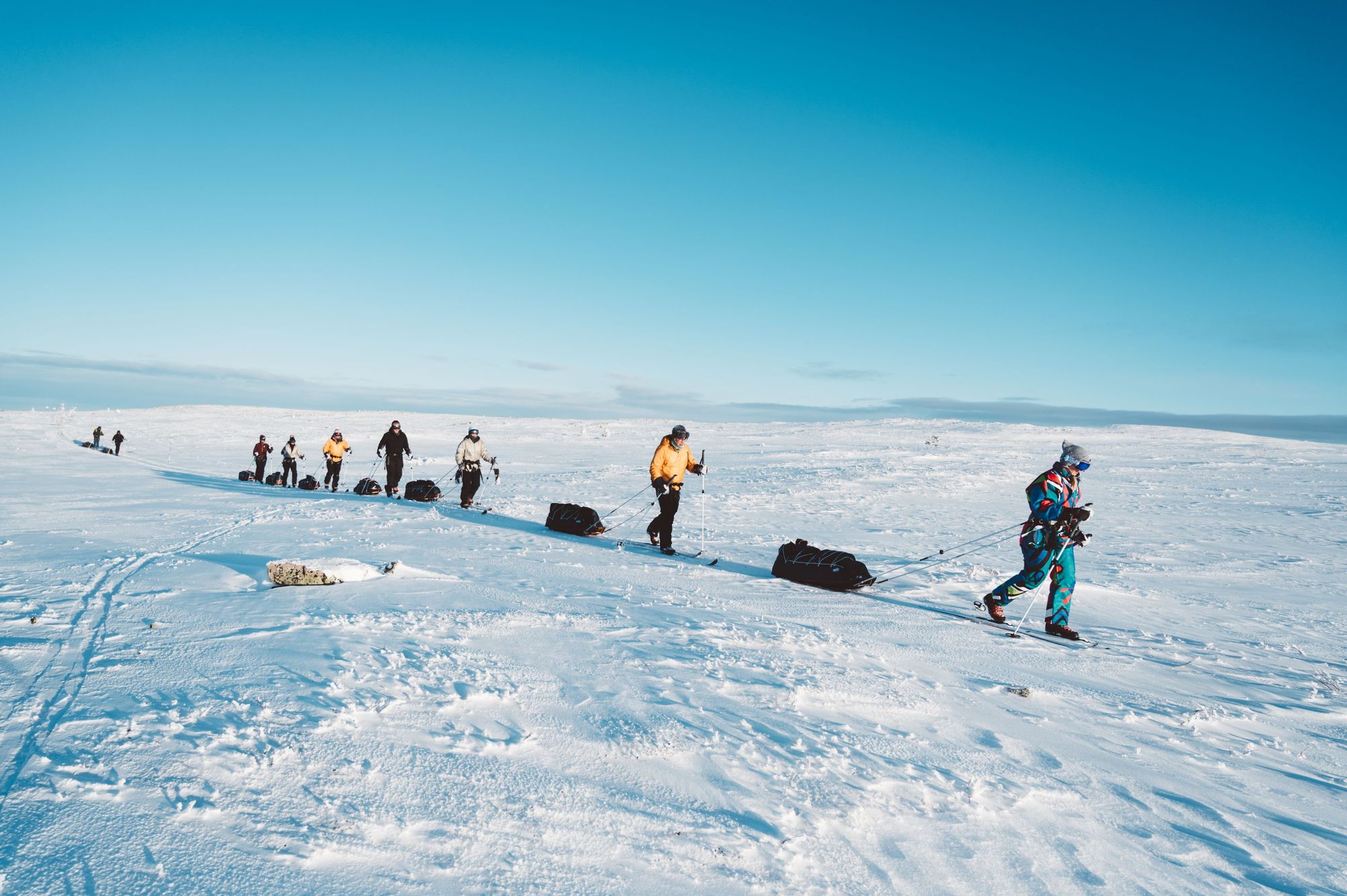 A snowy cabin awaits skiers after a lond day of pulling sleds. Photo: Do The North