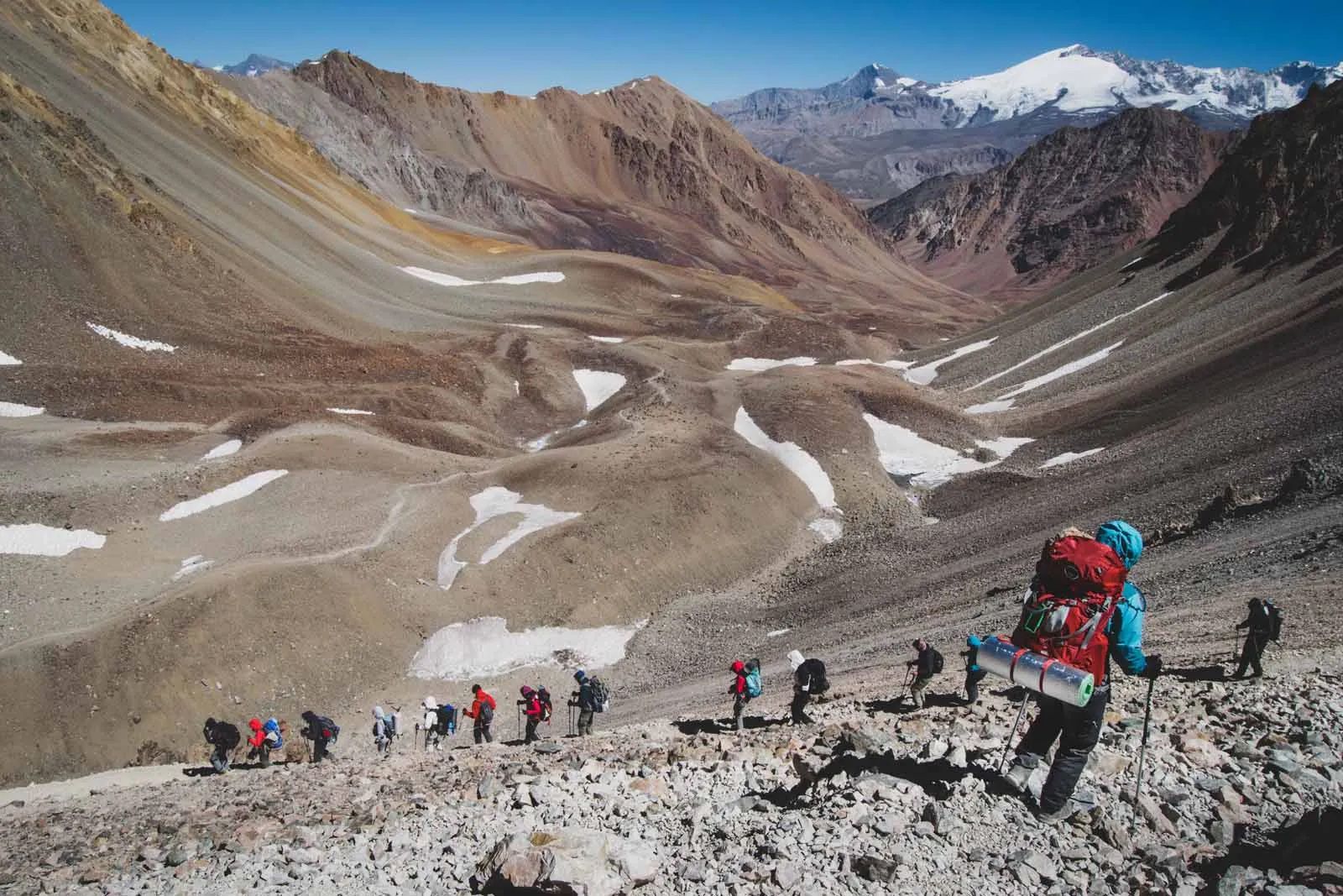 Hikers descending from the Portillo Argentino Pass in Argentina