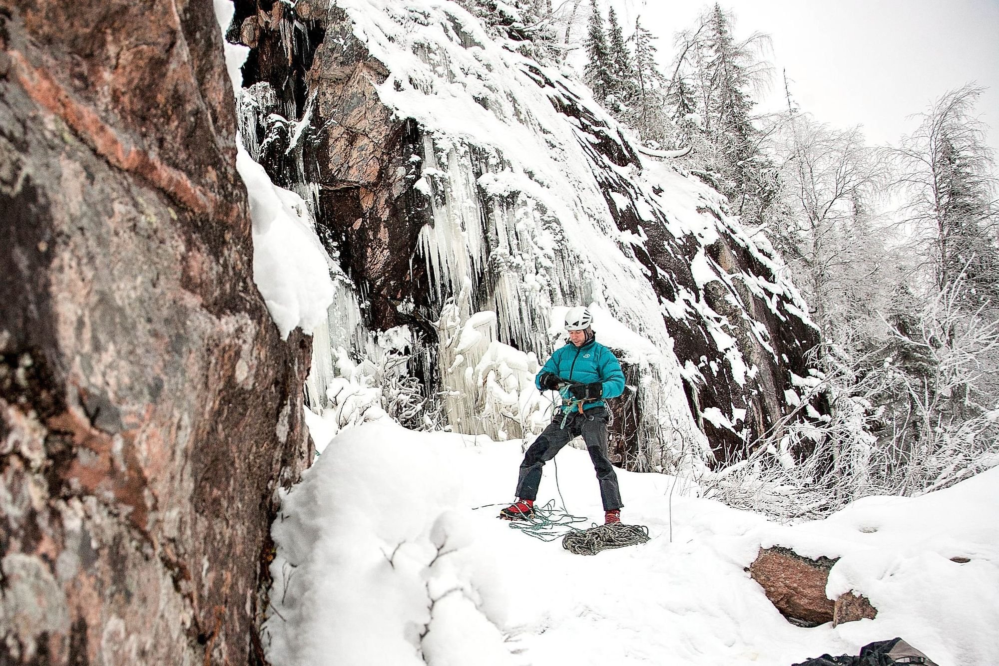 An ice climber gets ready to climb, on the frozen ice falls of Finnish Lapland. Photo: Bliss Adventures