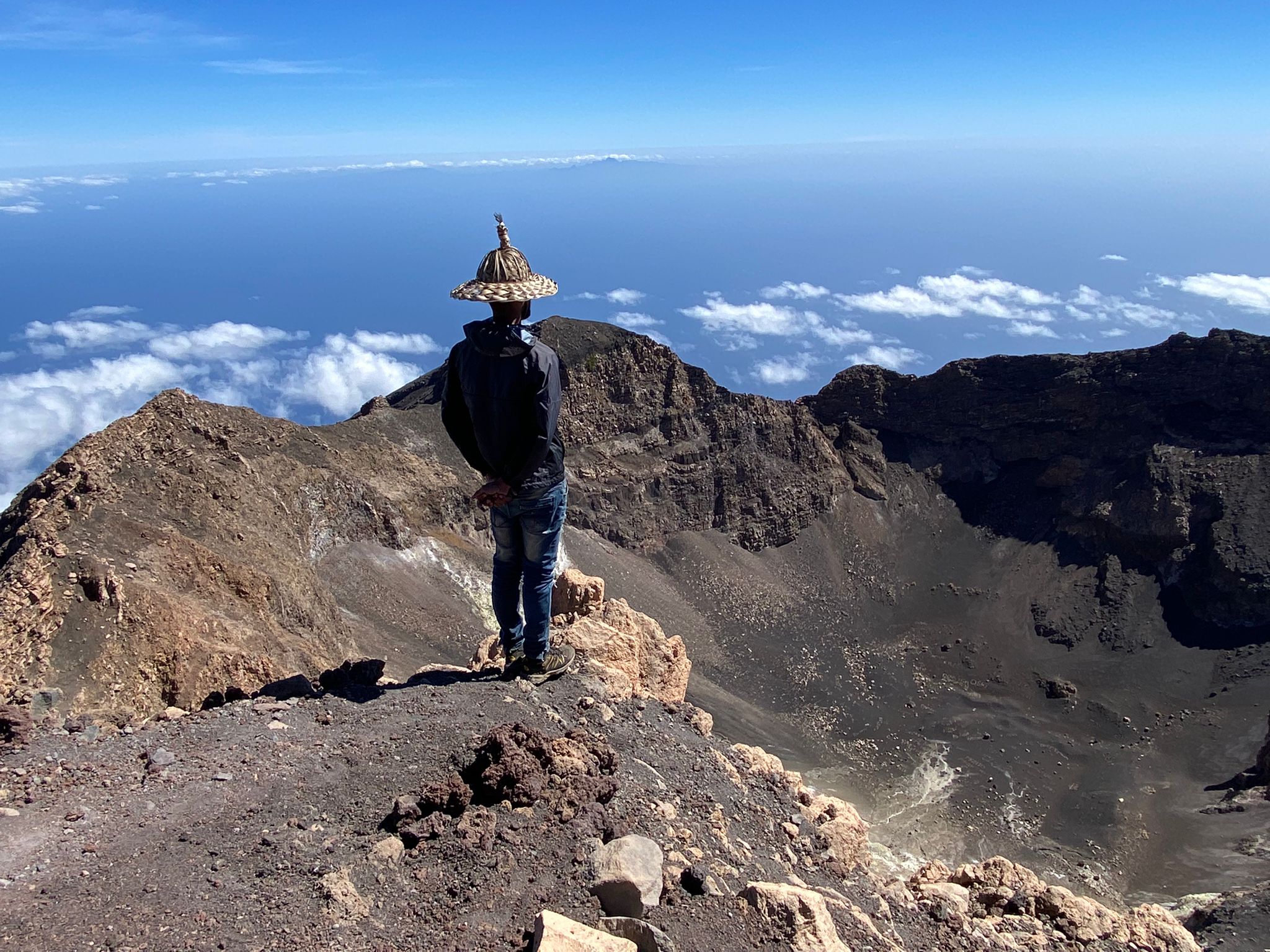 A mountain guide looks out across the caldera of Pico do Fogo, in Cape Verde