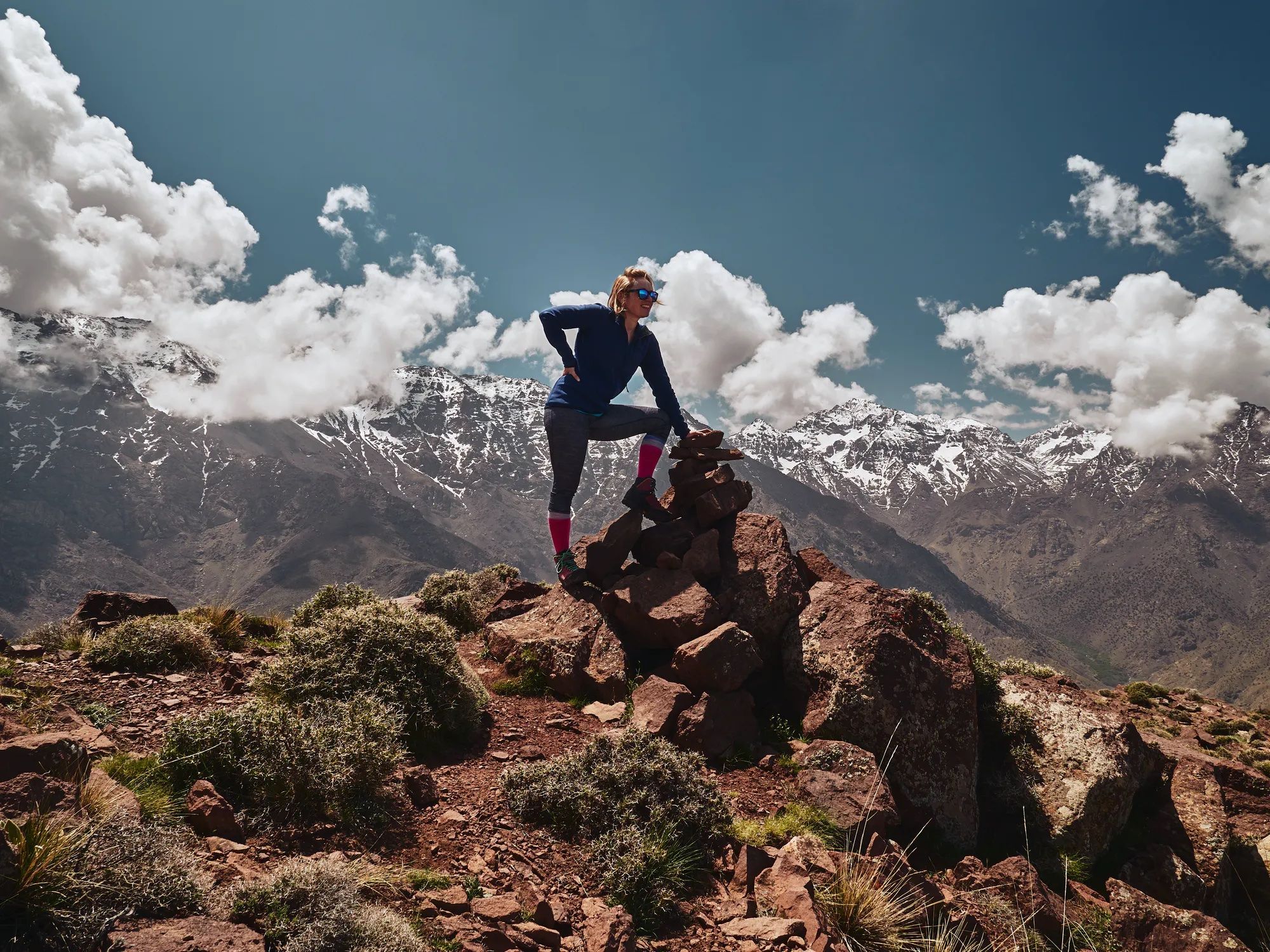 A female hiker poses in the Atlas Mountains, Morocco.