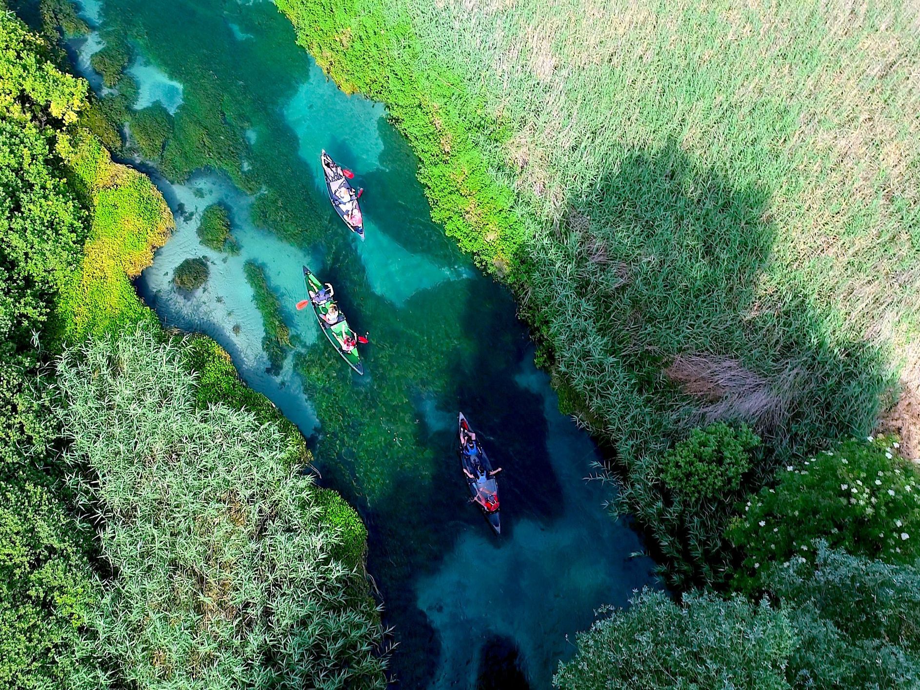 An aerial view of canoeists on Italy's Tirino River.