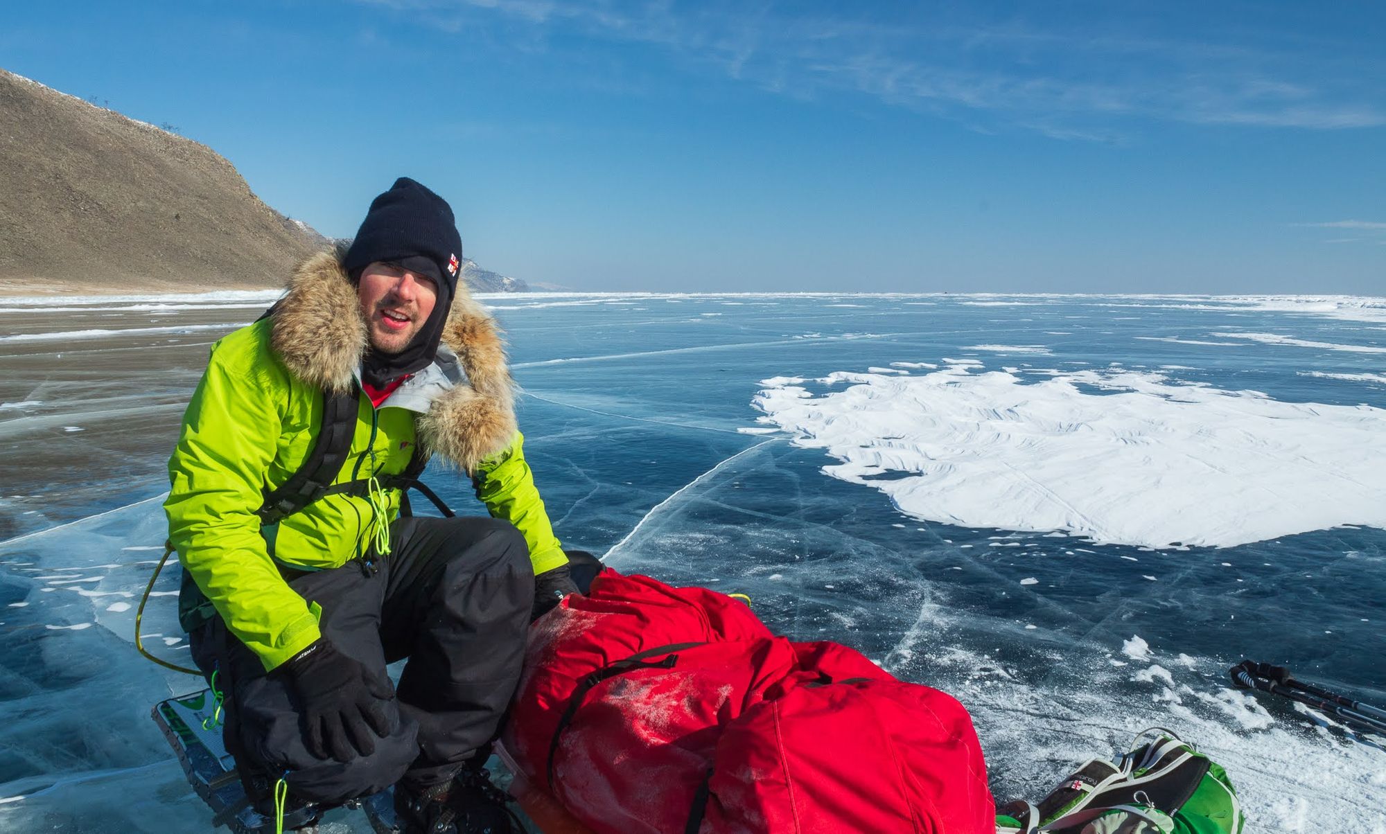 A man poses on frozen Lake Baikal, Siberia