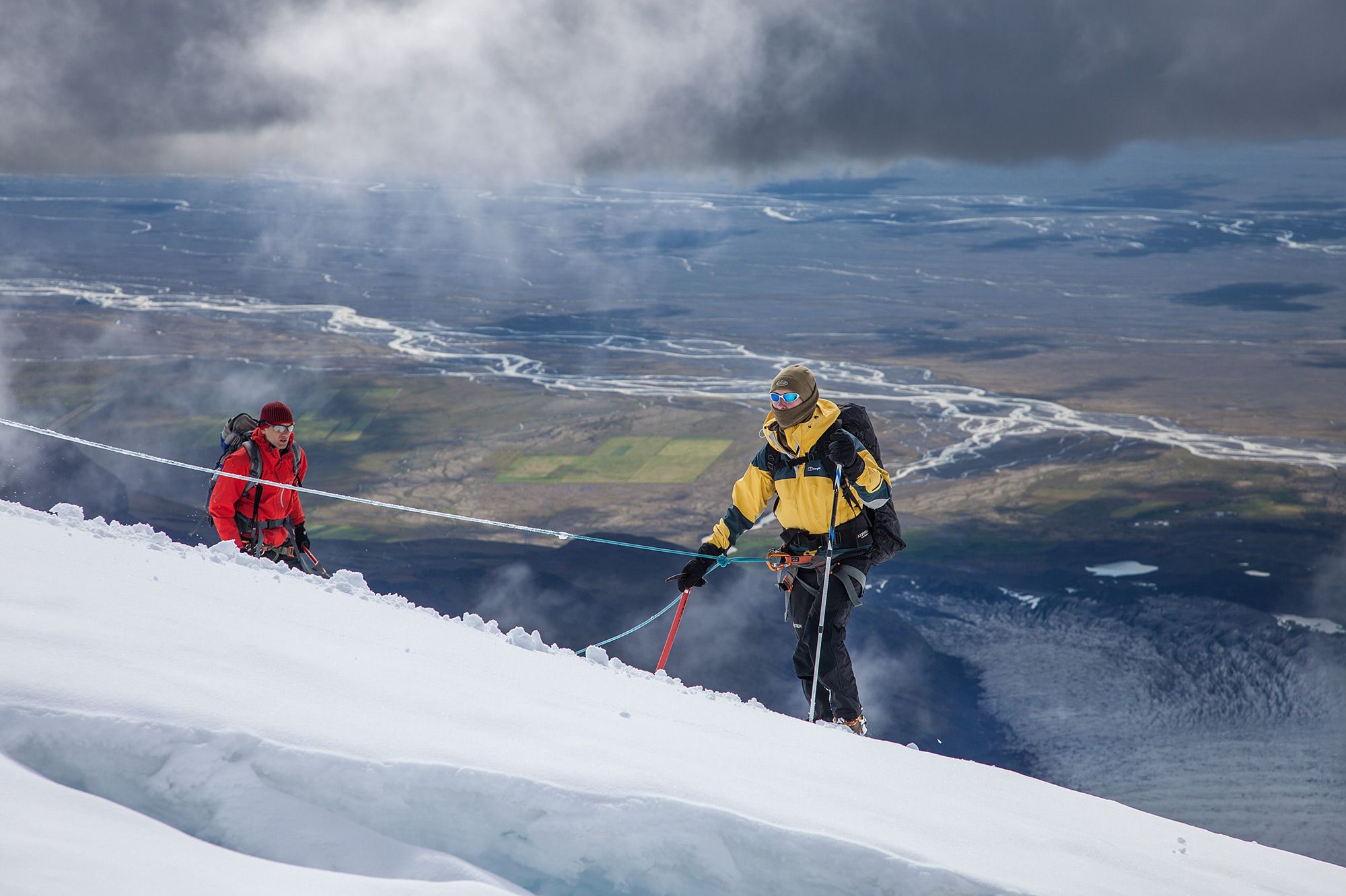 A climber ascending the steep snowy slopes of Hvannadalshnúkur, Iceland's highest mountain.