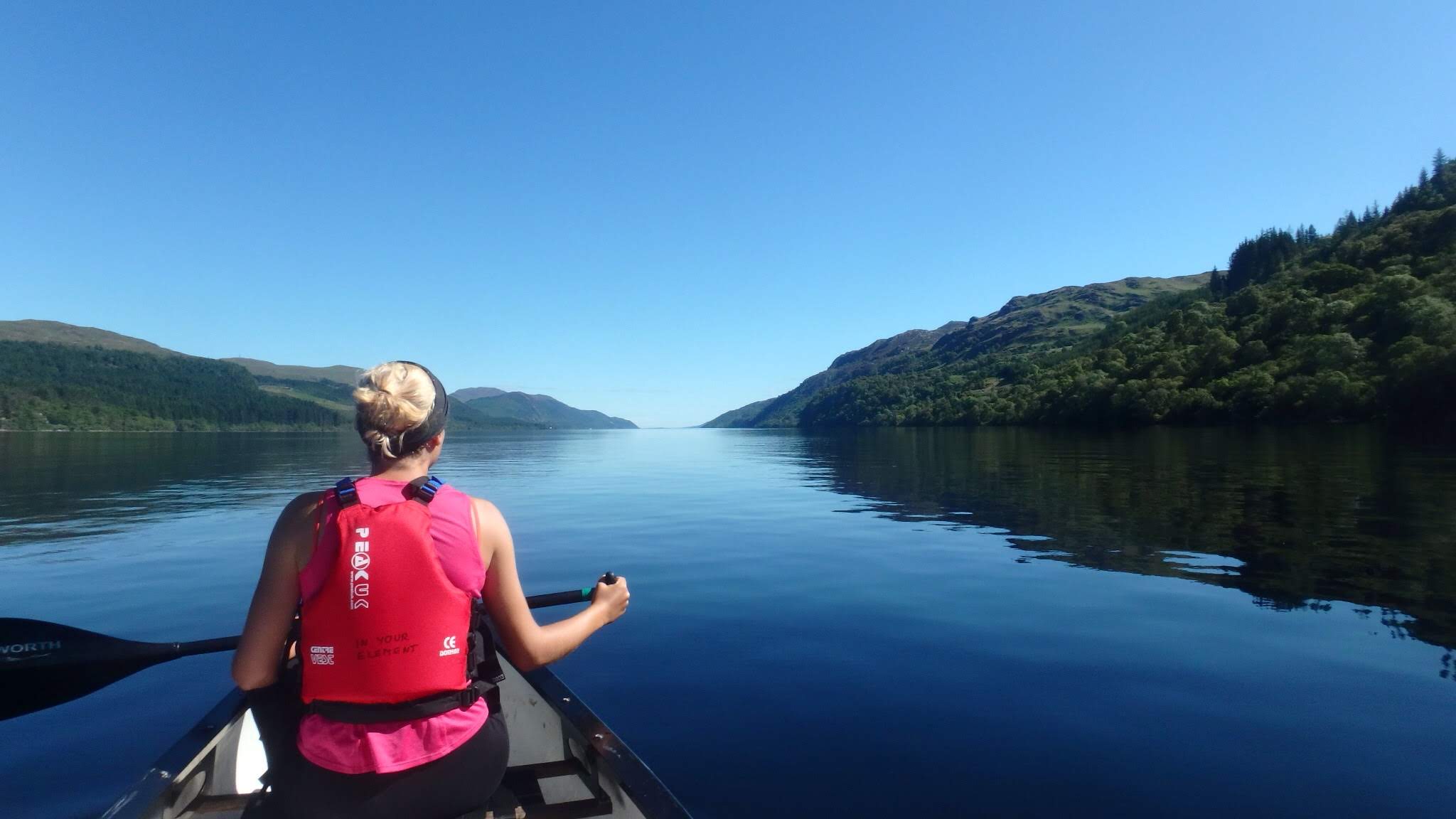 A woman canoeist on the Great Glen Trail, Scotland.