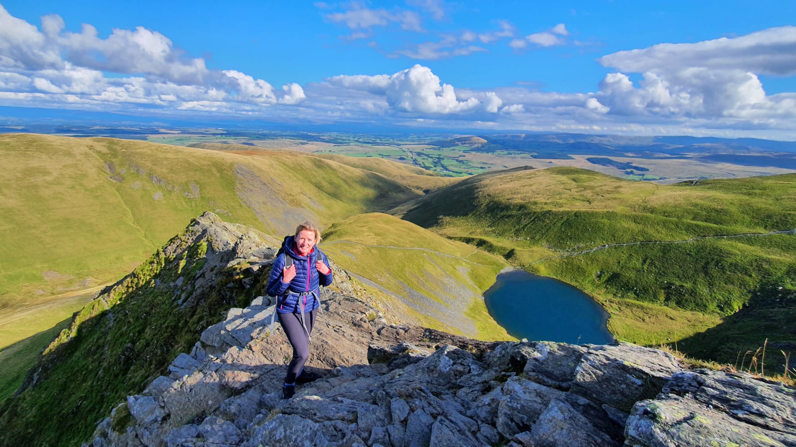 A woman hiking Blencathra Edge in the Lake District, Cumbria