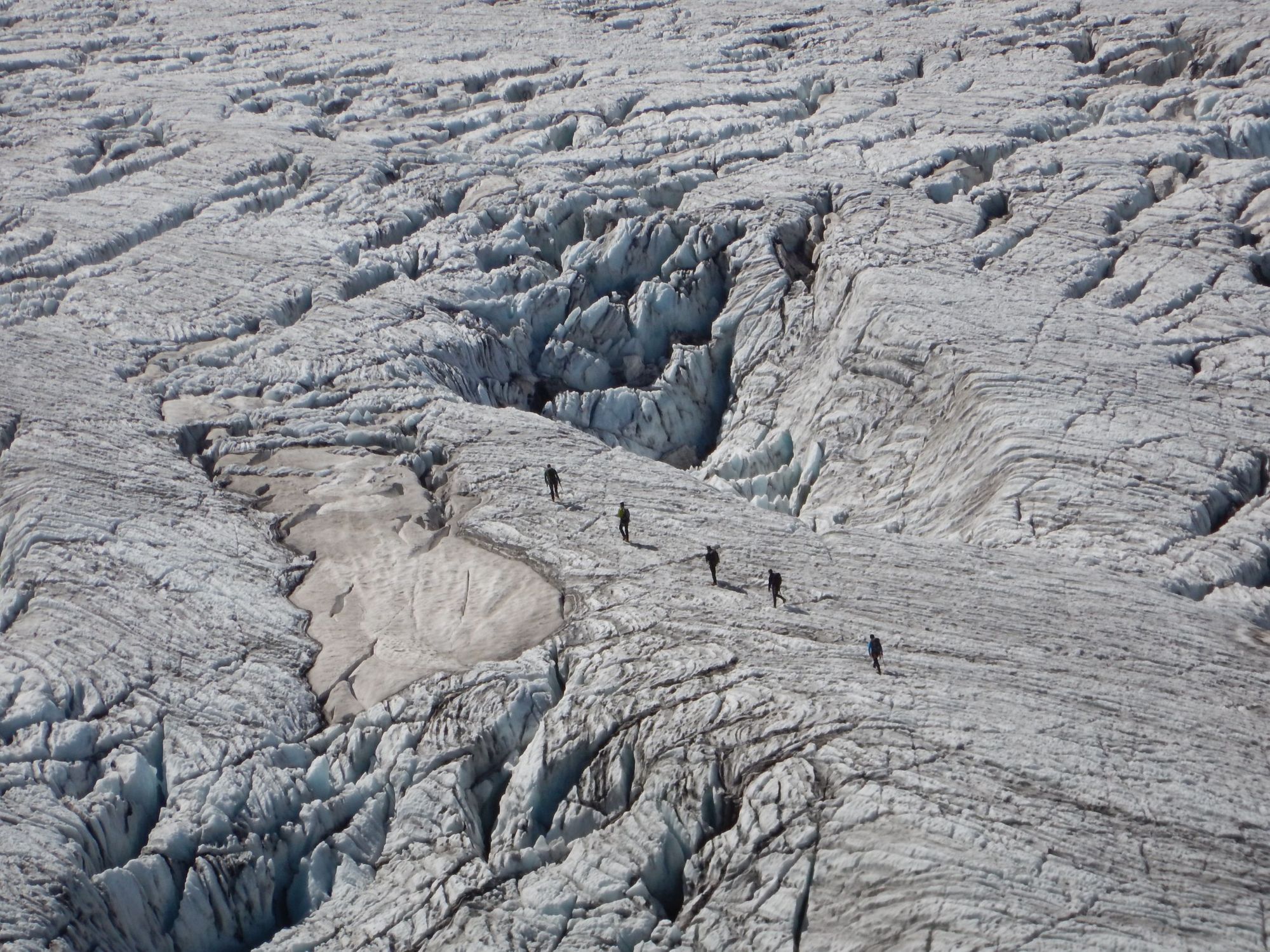 Climbers crossing a glacier on Mont Blanc mountain.