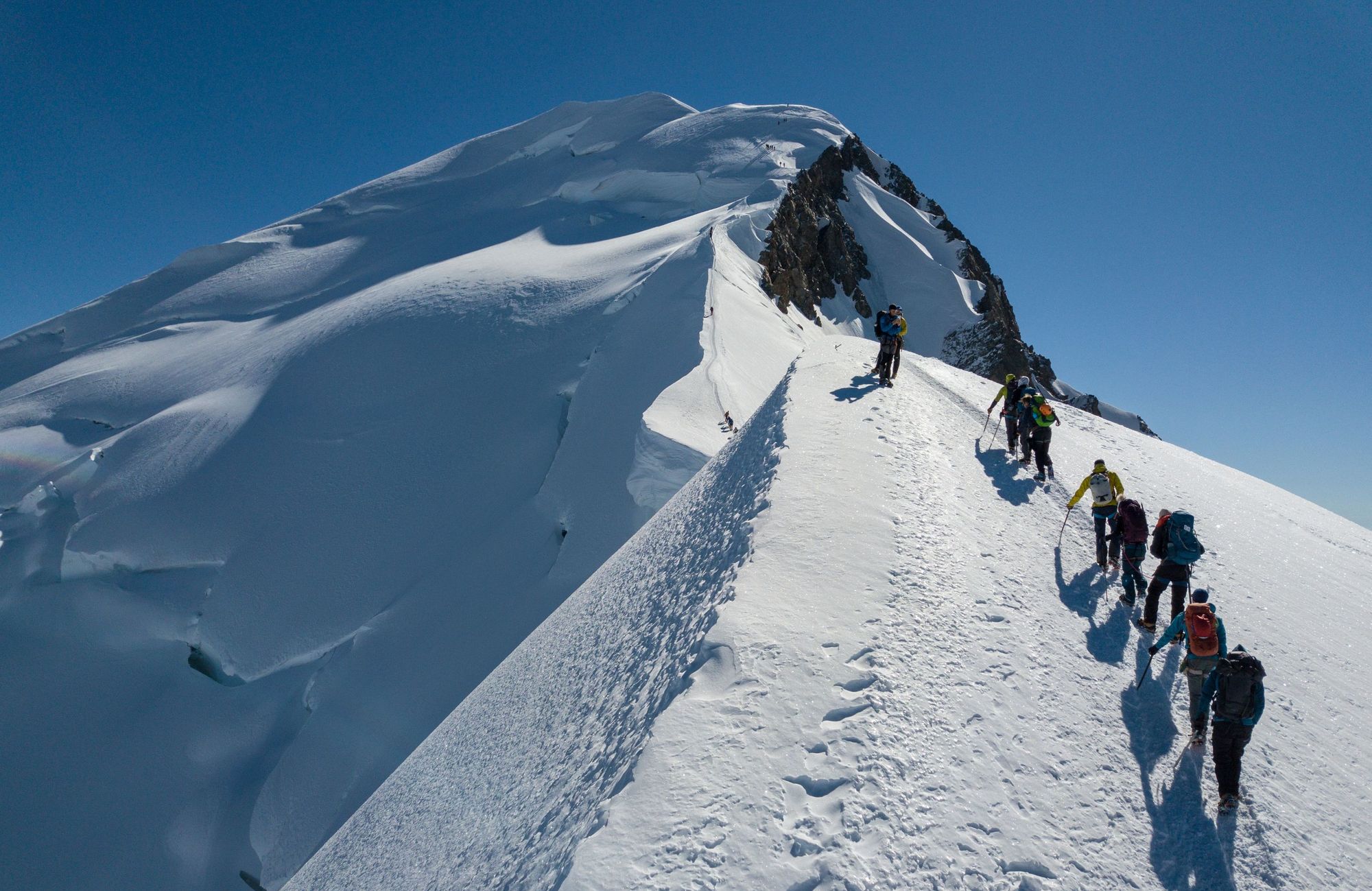 A small group of mountaineers climb Mont Blanc.