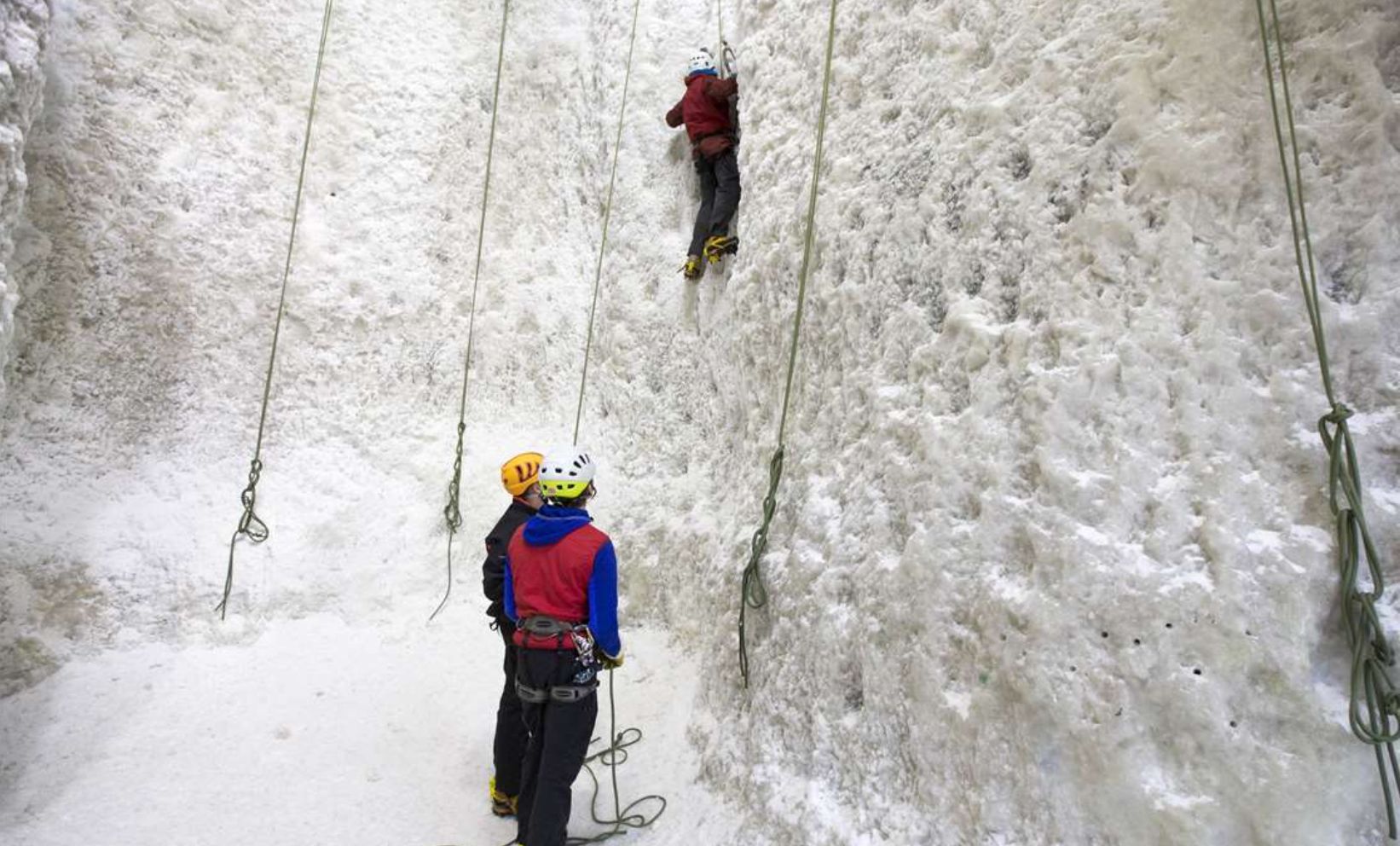 Climbers learning how to ice climb at the Ice Climbing Centre in Kinlochleven, Scotland