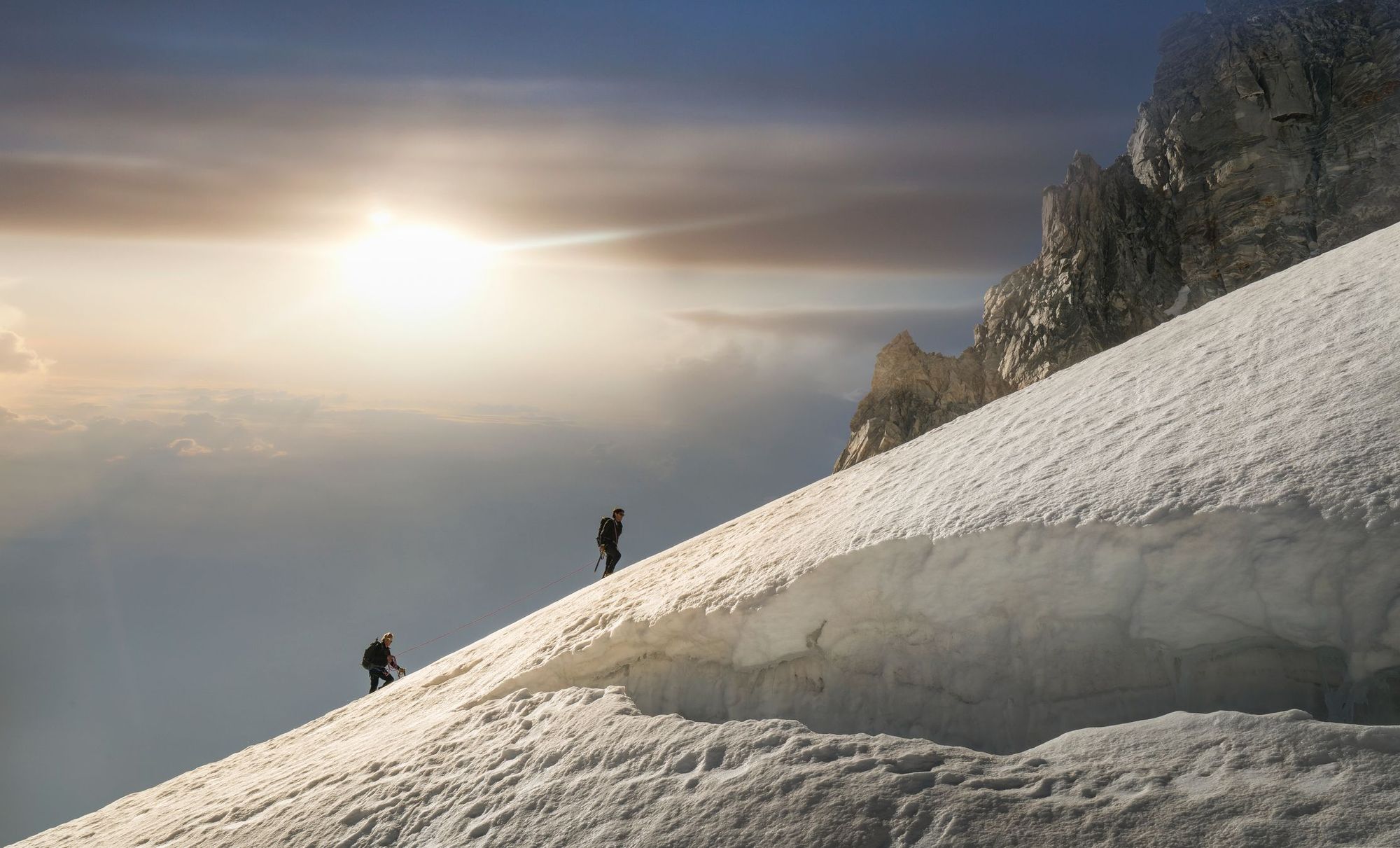 Two climbers on a glacier in Mont Blanc.