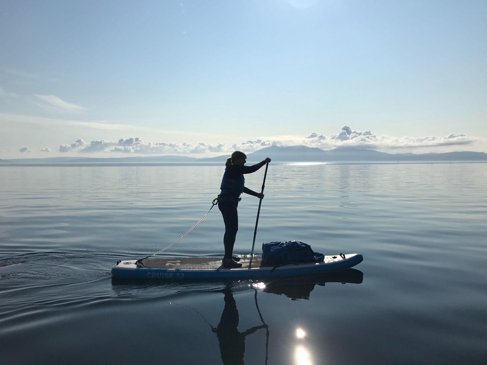 A woman out on her paddleboard.