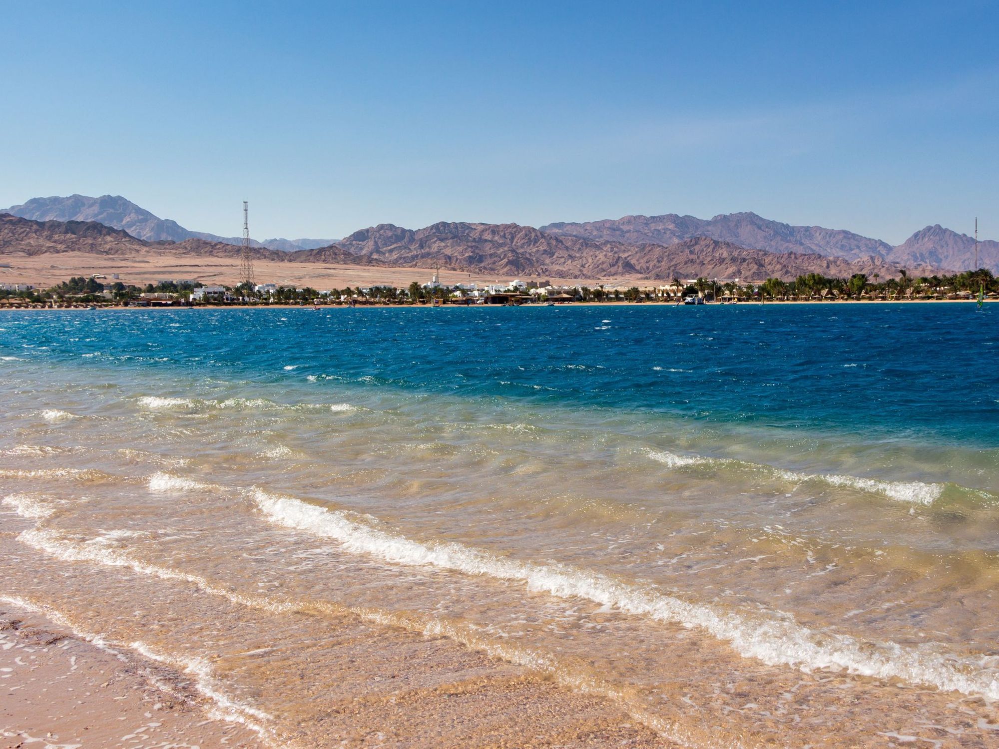 Dahab, Egypt, sea in the foreground and desert in the background.