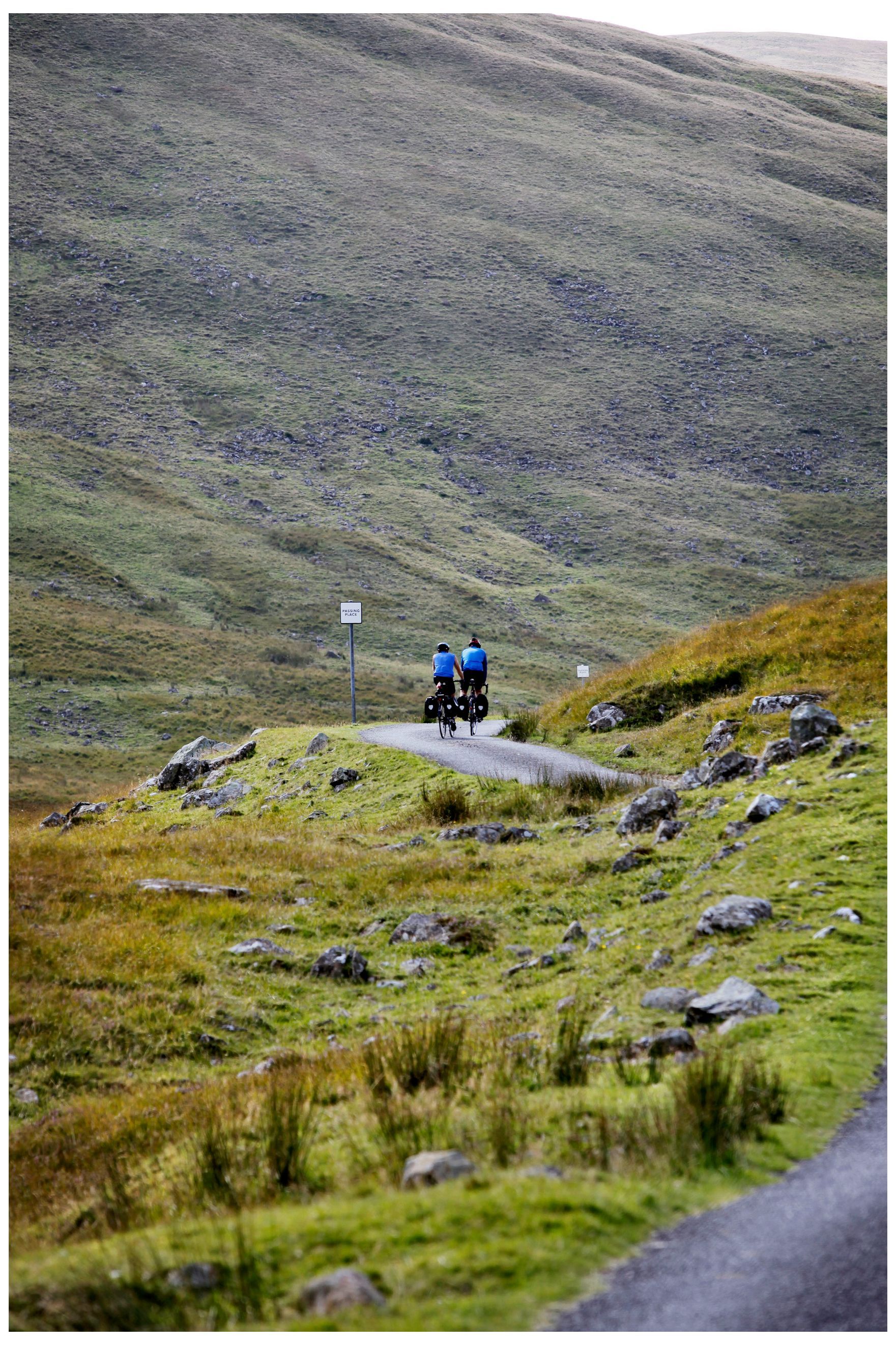 Cyclists on a winding road in the south of Scotland. Credit: Paul Dodds