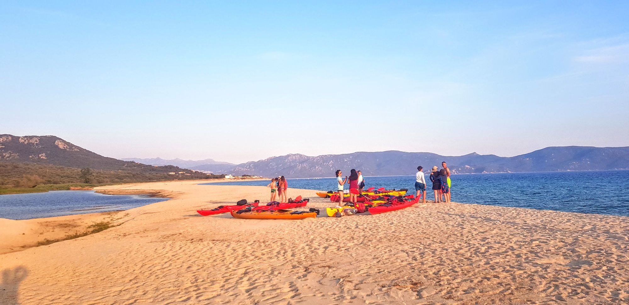 Kayakers on a Corsican beach.
