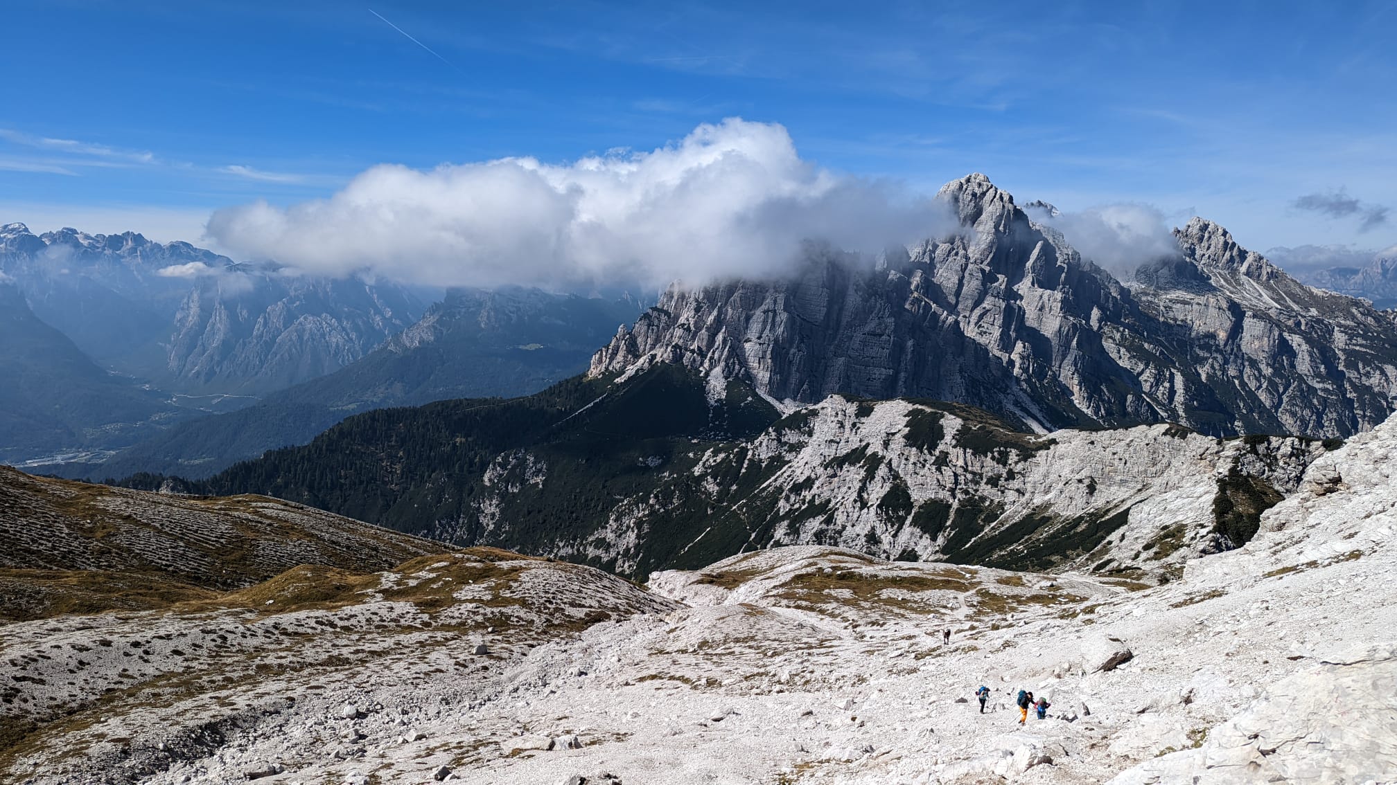 Hikers trekking in the Dolomites, Italy.