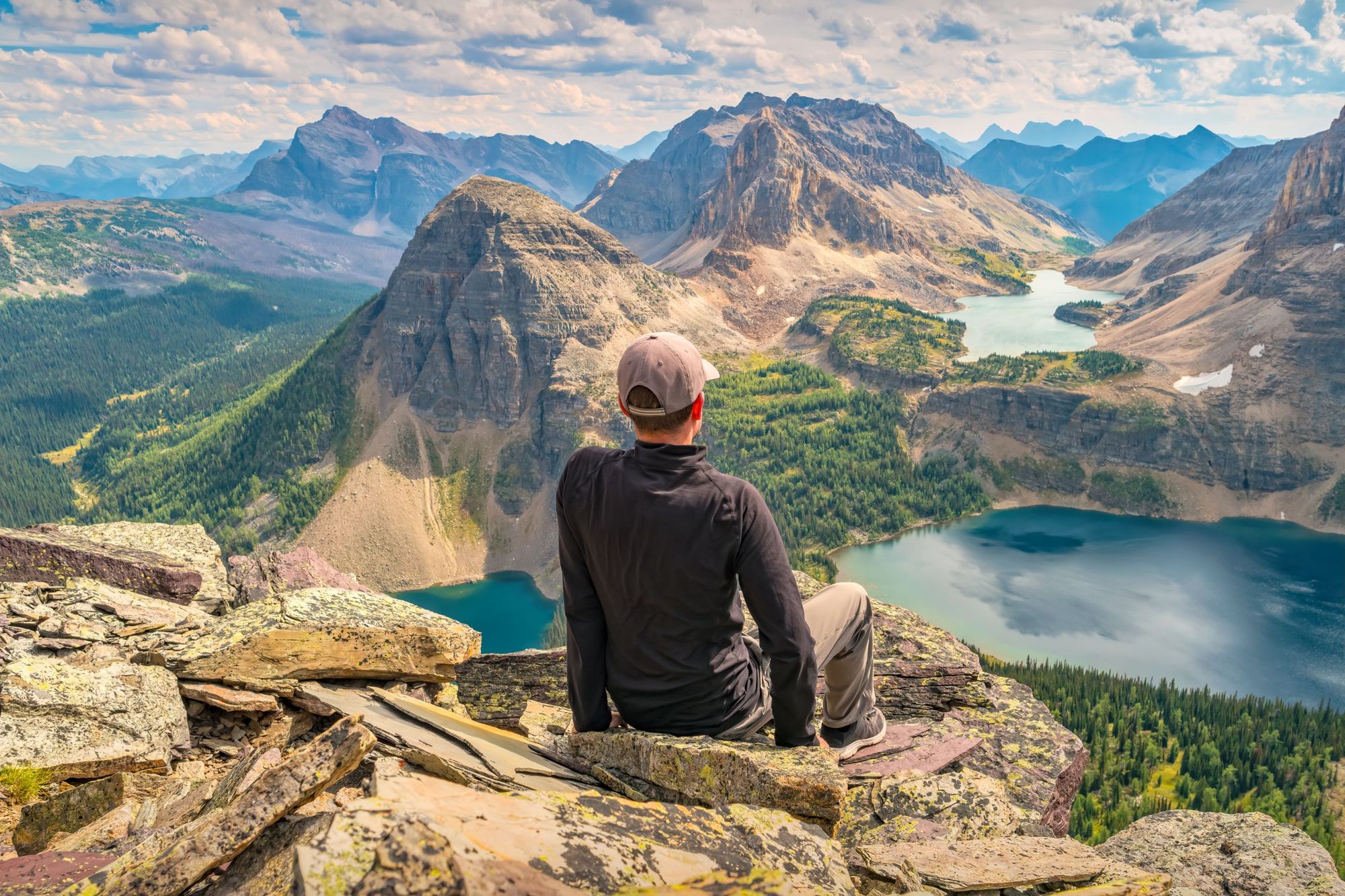 A hiker enjoys view from Pharaoh Peaks, Egypt Lake in Banff National Park in the Canadian Rockies. Photo: Getty