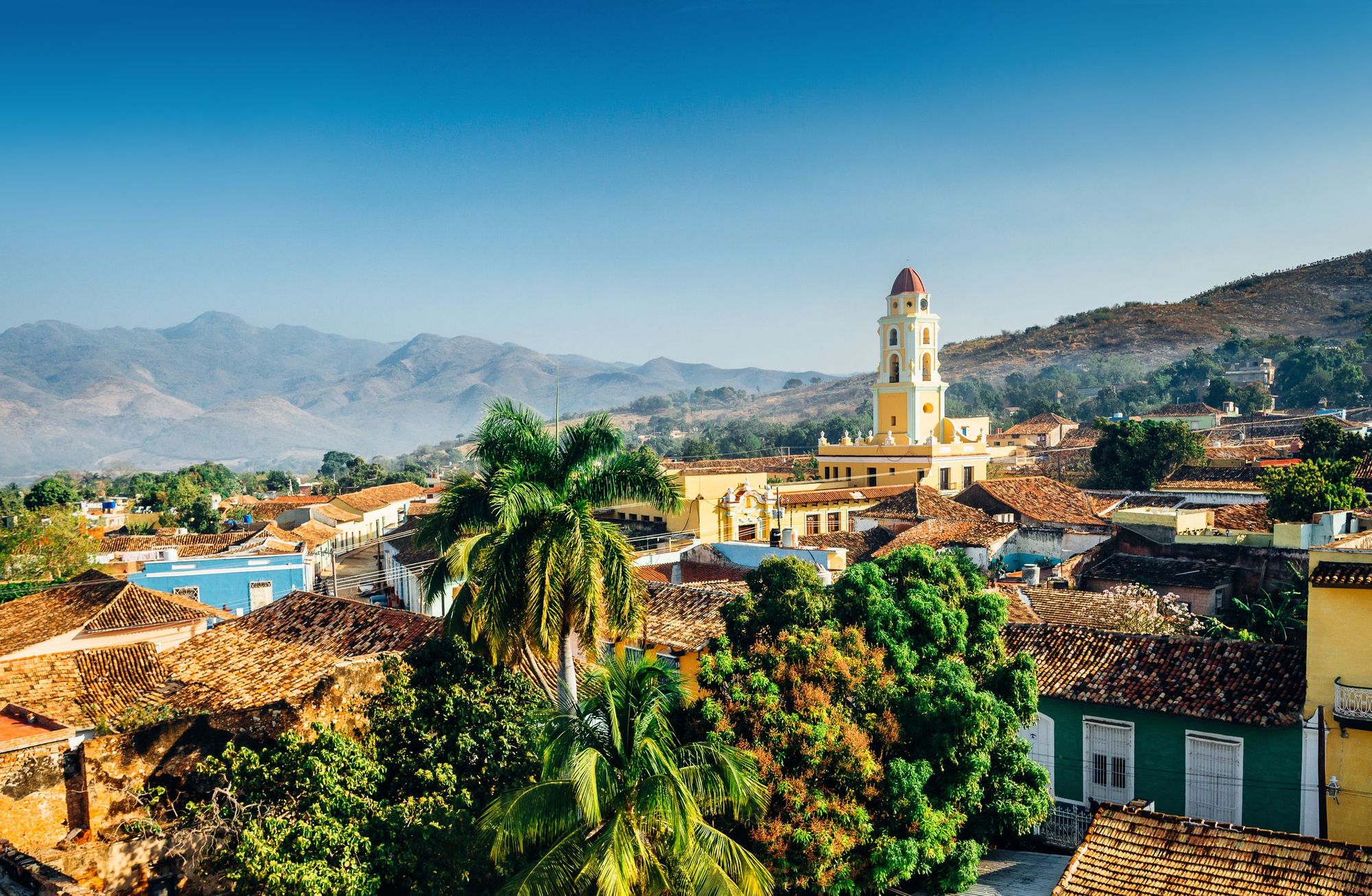 The scenic town of Trinidad, home to various casas and backdropped by the Escambray mountains. Photo: Getty