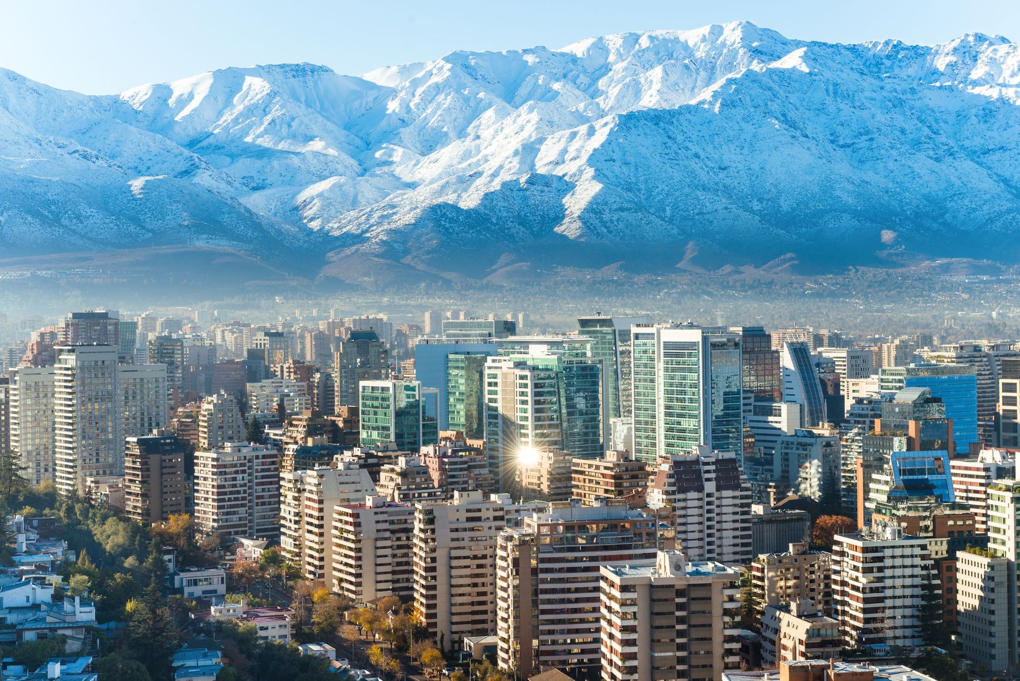 An aerial view of Santiago skyline, with the snow-blanketed might of the Andes Mountains behind. Photo: Getty