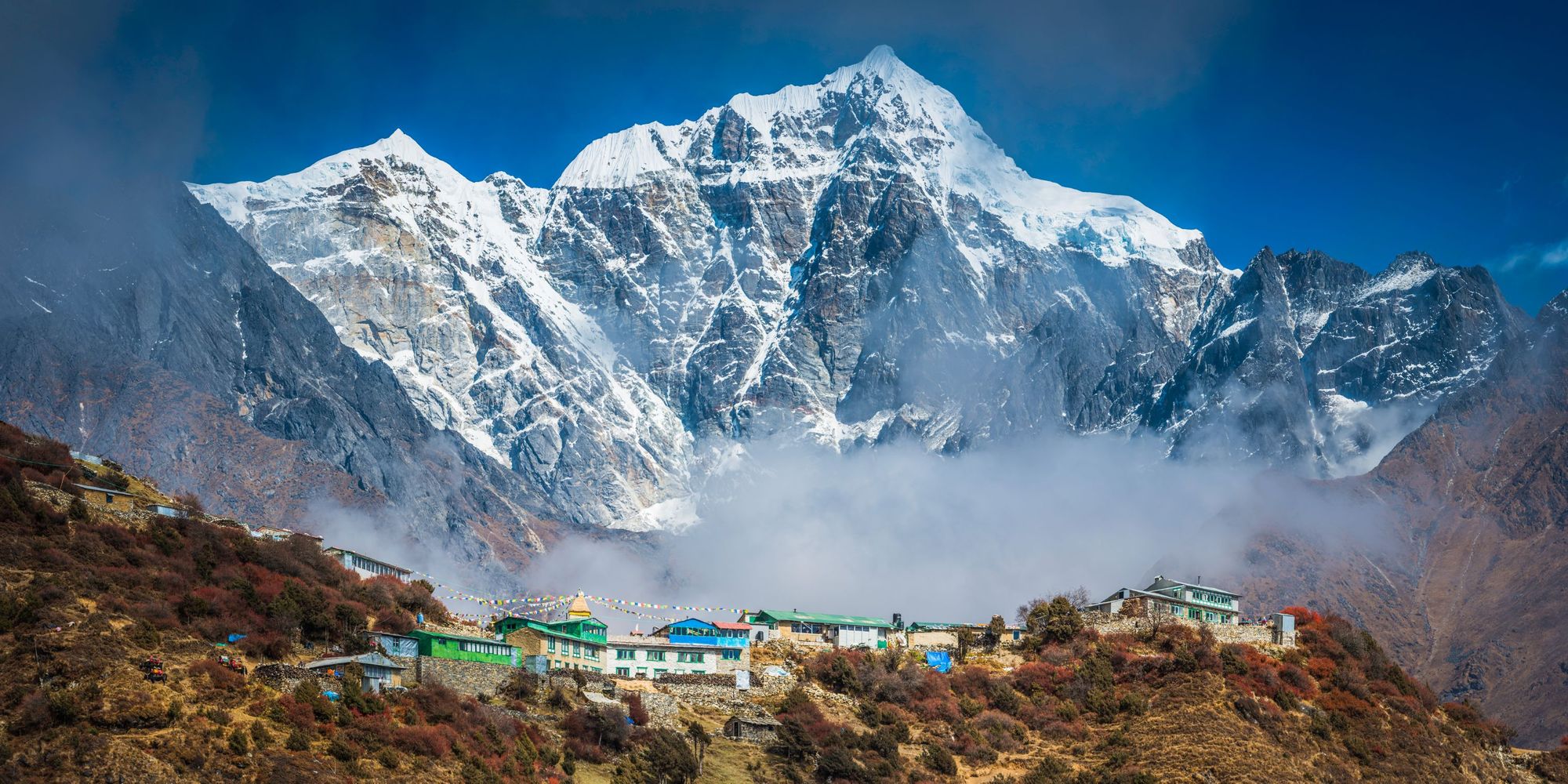 The magnificent snow-capped peak of Tawoche (6542m) towering over the Khumbu valley and teahouse lodges high on the Everest Base Camp trail. Photo: Getty