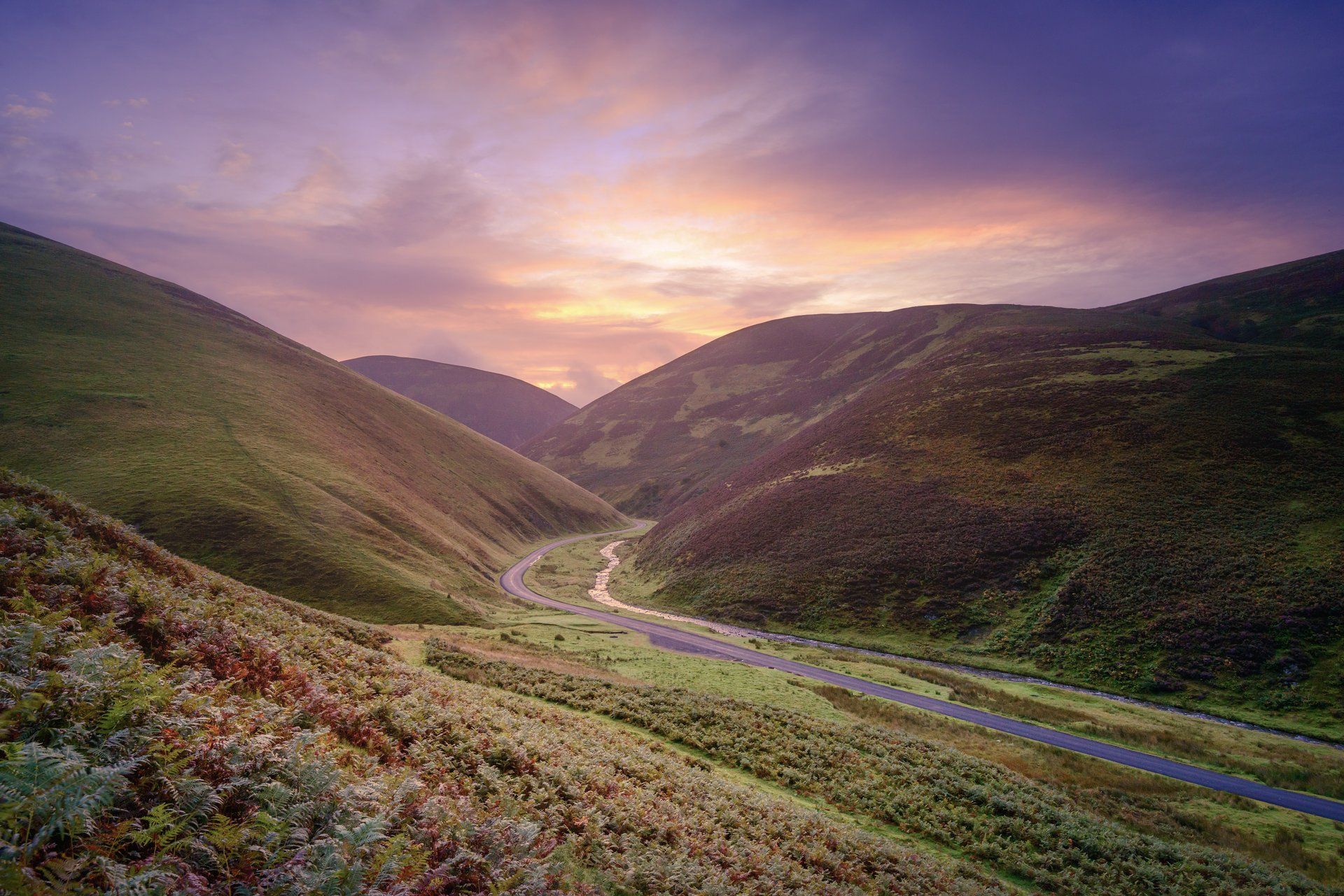 The sun sets over the beautiful roads of the south of Scotland,