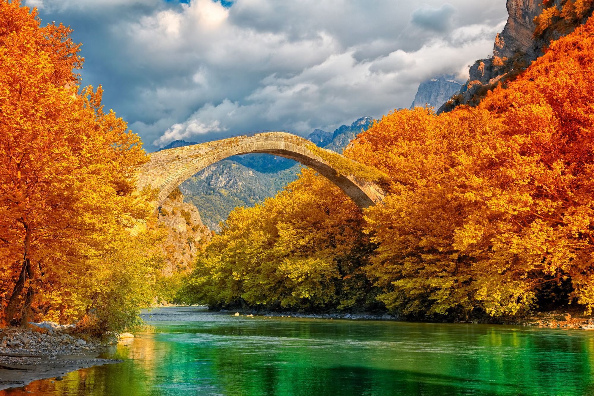 Autumn foliage and stone bridges in Zagori, Greece.