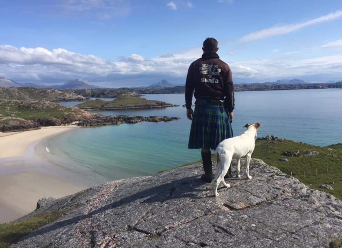 Chris Lewis with his dog Jet, on his journey walking around the UK's coast. Photo: Chris Lewis.