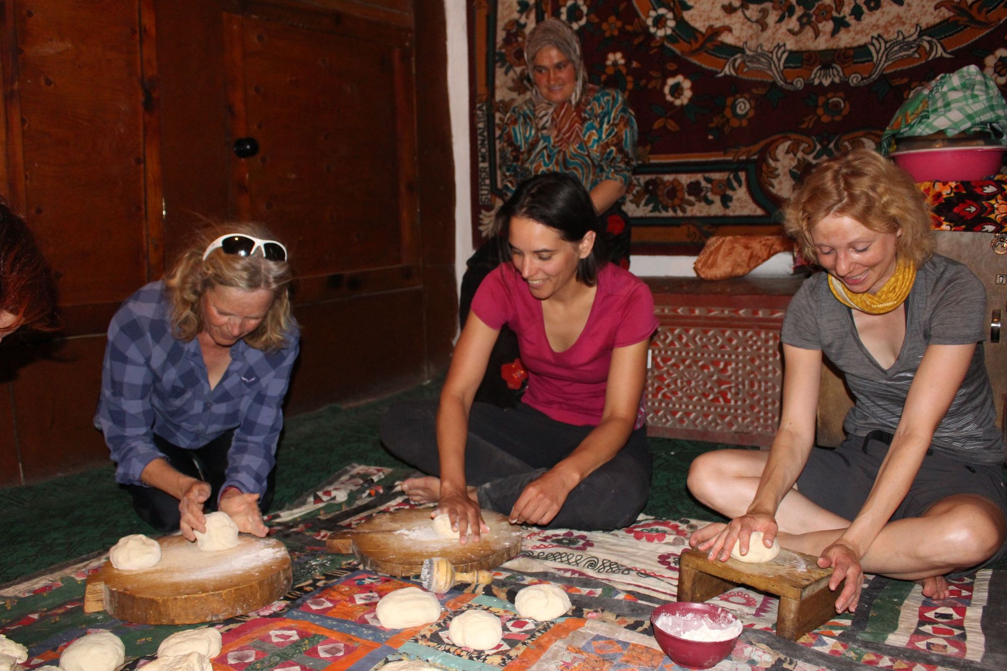 Tourists making flat breads in a traditional Tajik homestay. Photo: Orom Travel