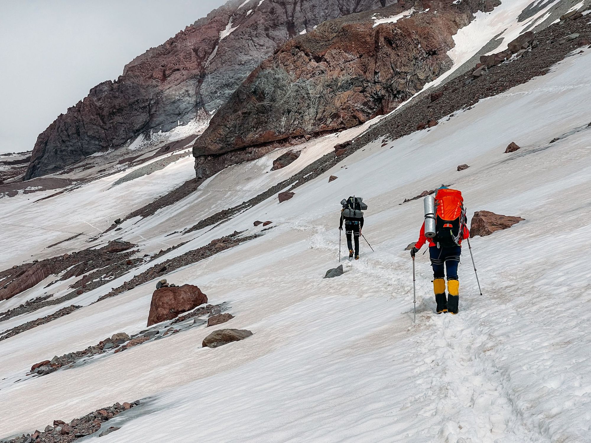 Two climbers trek through the snow of Mount Kazbek, Georgia. Photo: Getty.