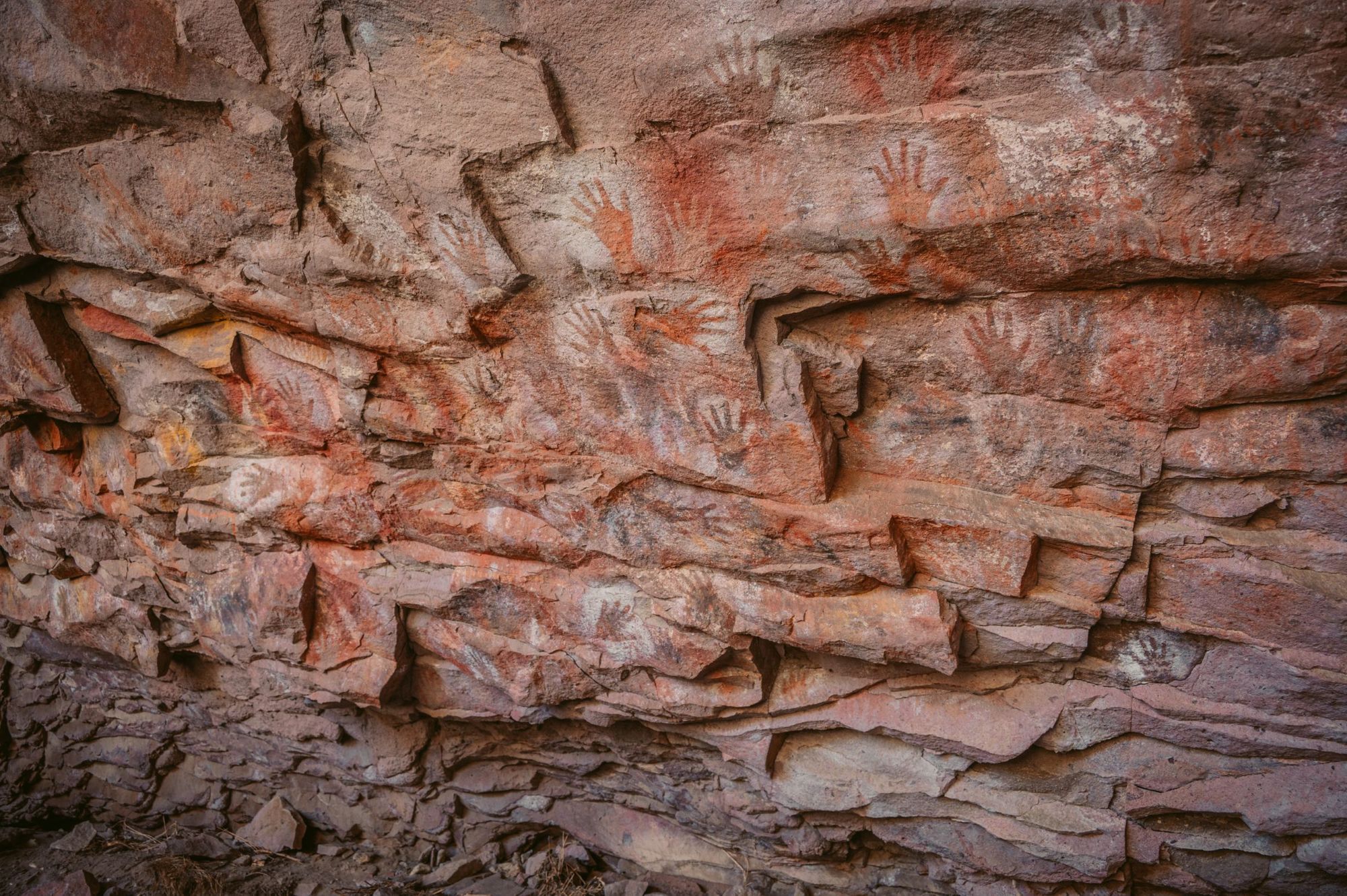 Just a few of the hand paintings which line the walls at Alero Charcamata. Photo: Horacio Barbieri