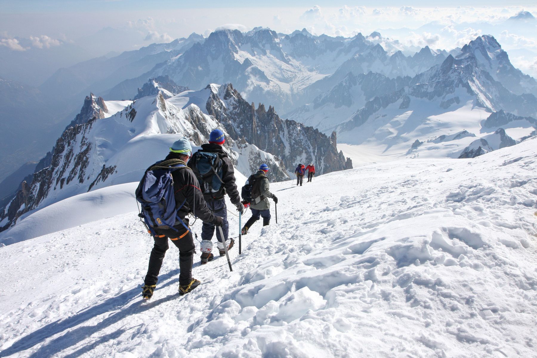 Trekkers in the snowy, high-altitude environment of Mont Blanc. Photo: Guillame Besnard.