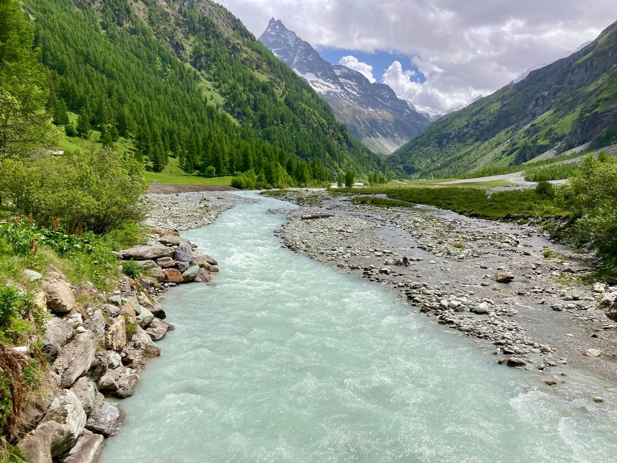A glacial river and mountainous greenery as you come into the town of Zinal. Photo: Getty