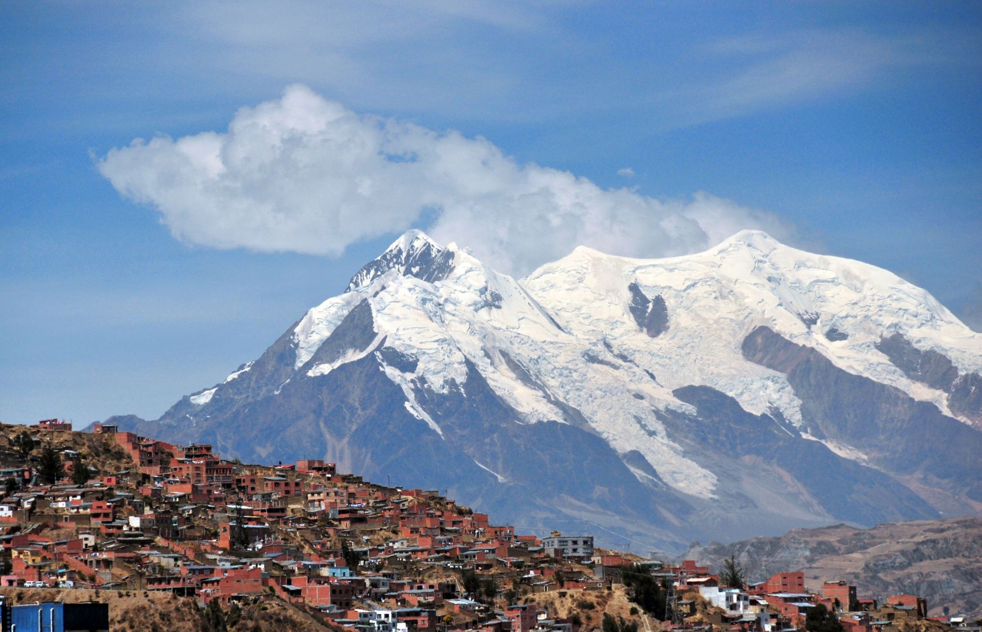 The southern suburbs of La Paz, the higest capital city in the world, with Bolivia's biggest mountain, La Paz, Ilimani, behind. Photo: Getty