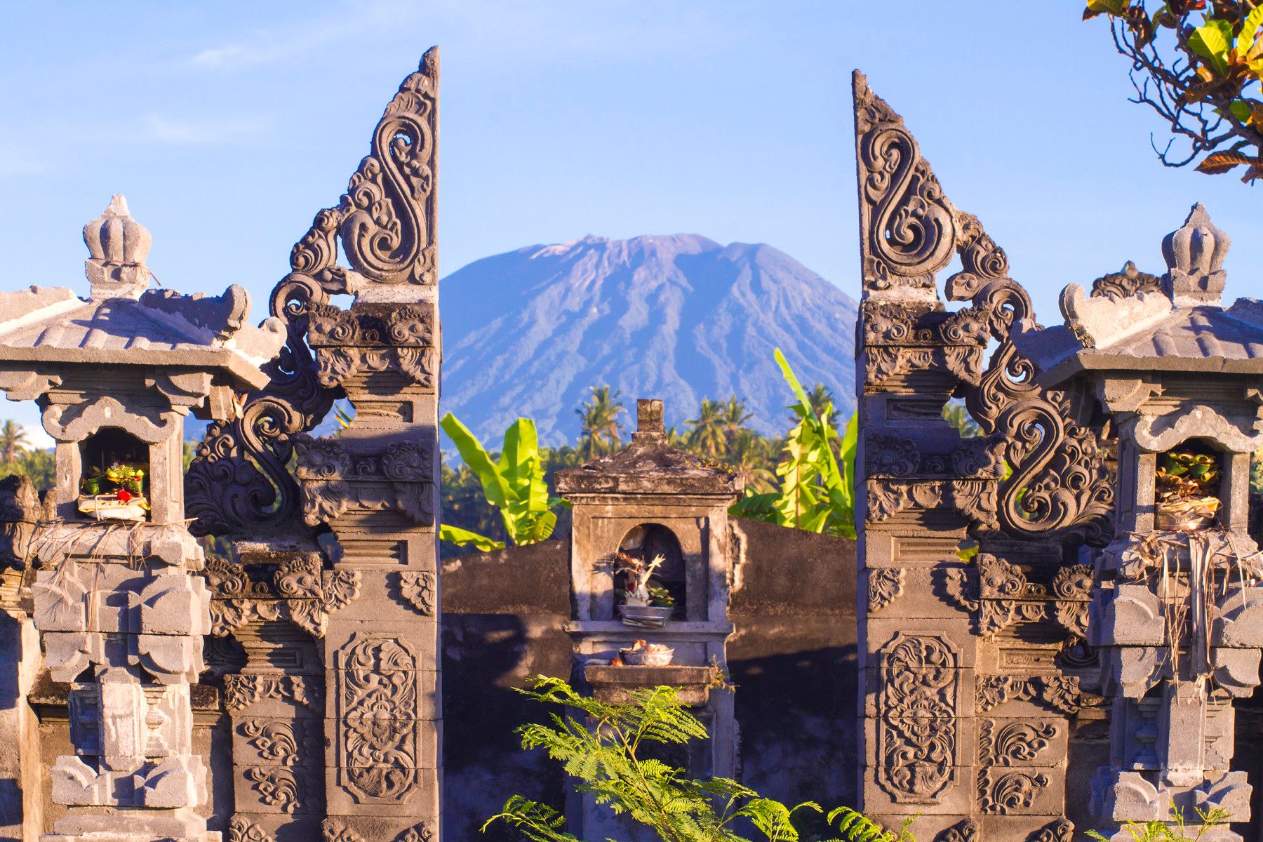 A volcano glimpsed through a temple gate in Indonesia.