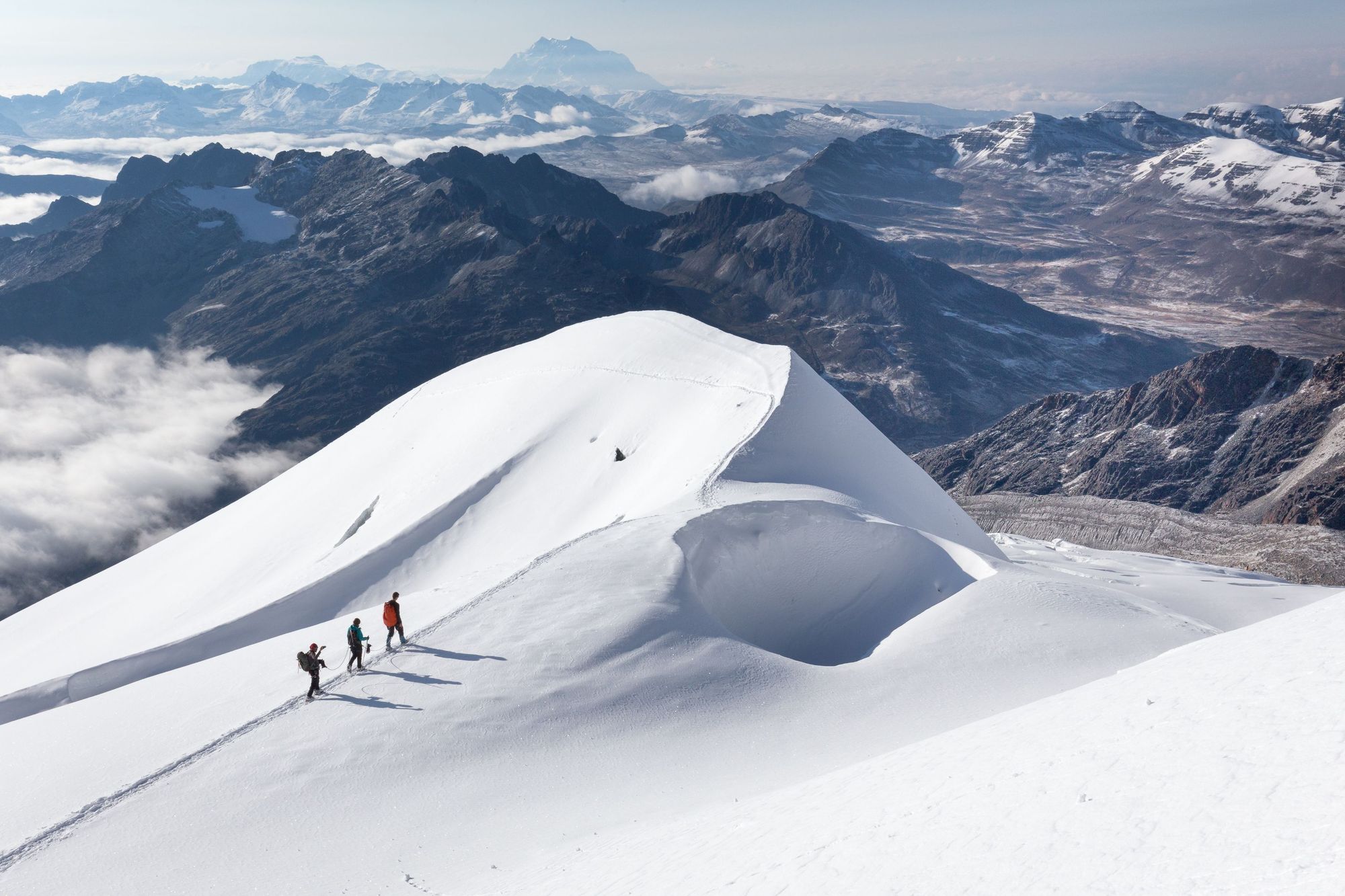Three hikers climbing Huayna Potosi, a mountain near La Paz in Bolivia (one of the best hikes in the Altiplano for obvious reasons). Photo: Getty