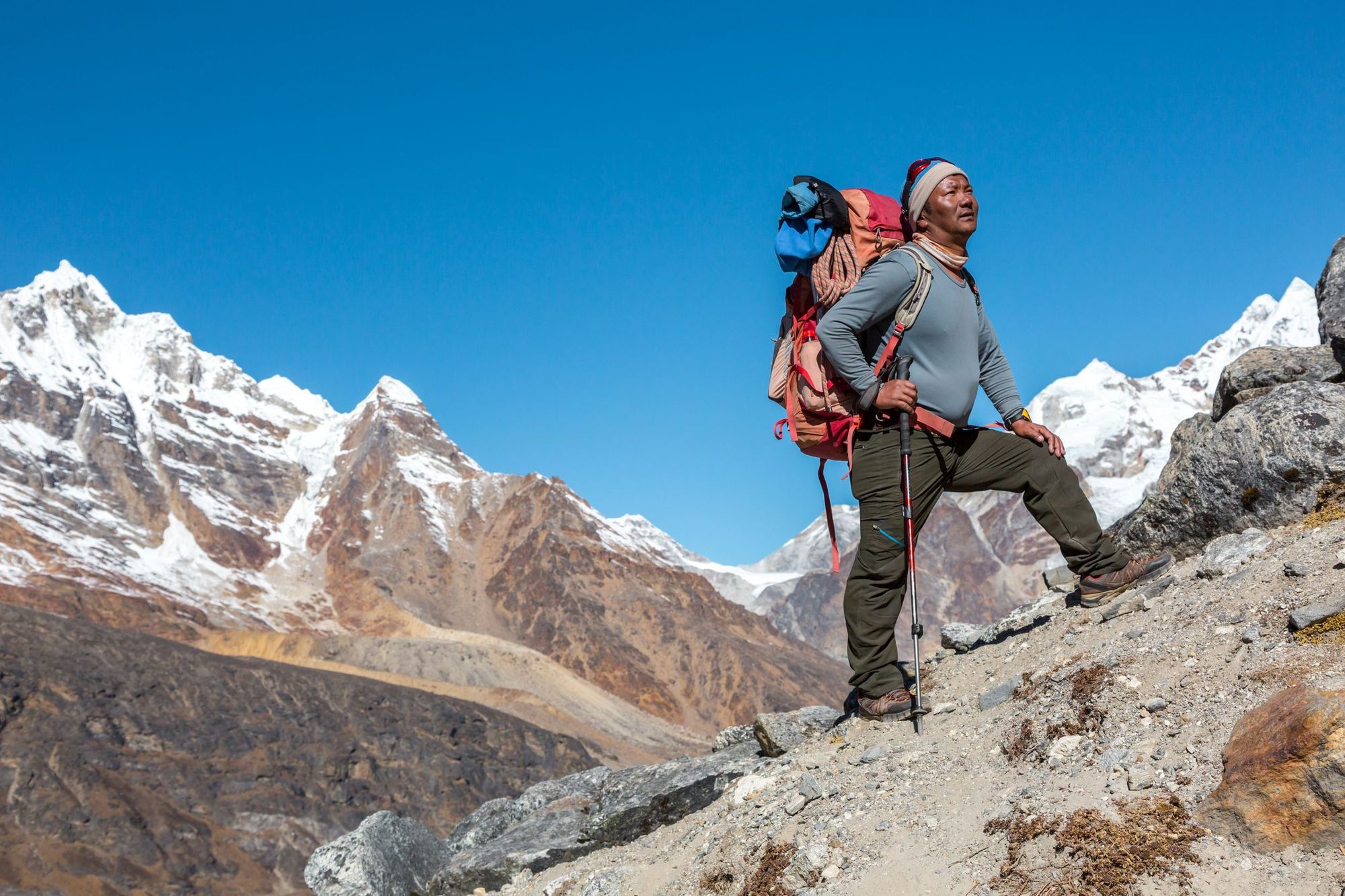 A Nepalese mountain guide poses in the Himalayas.