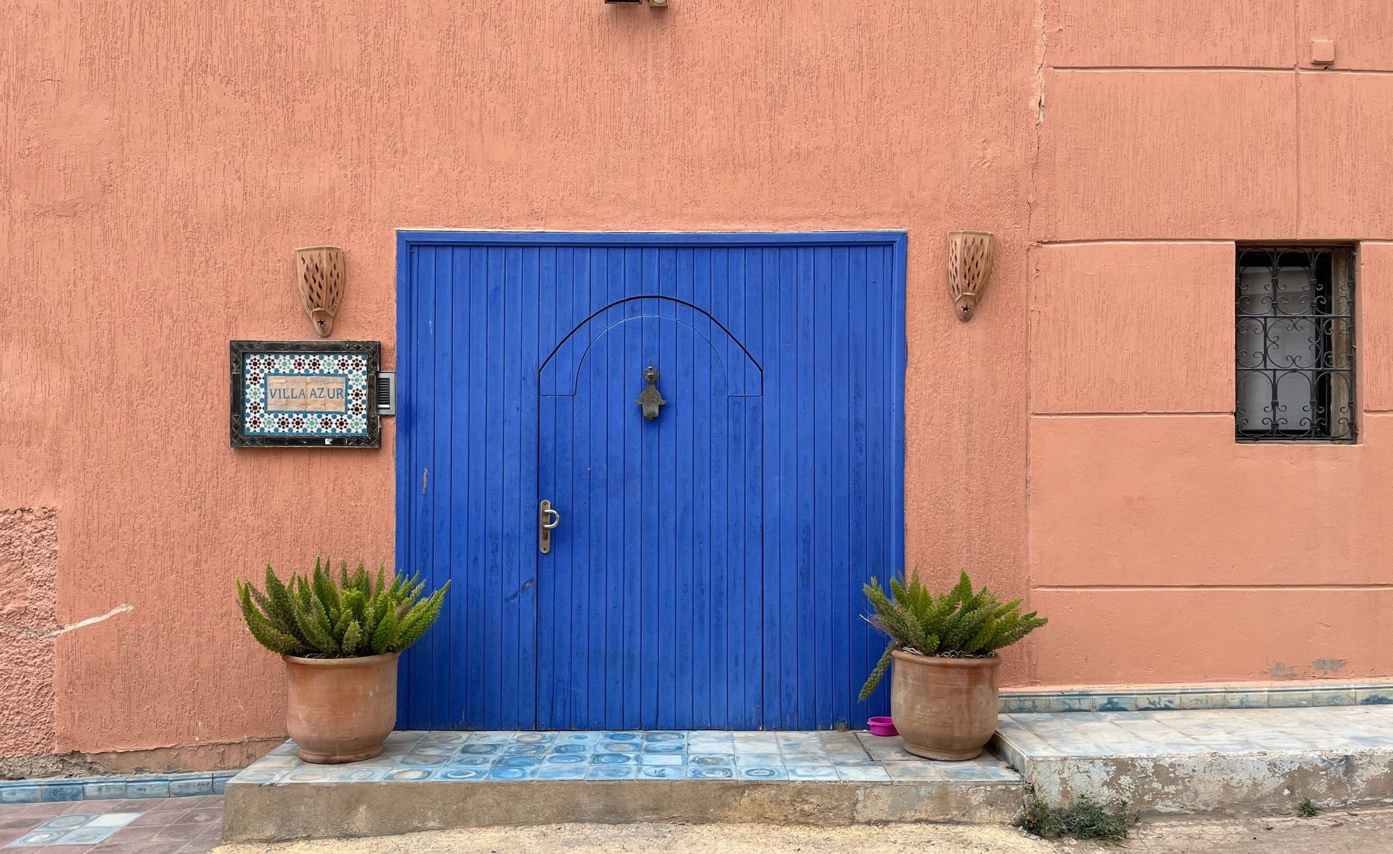A cobalt coloured door on a street in Morocco.