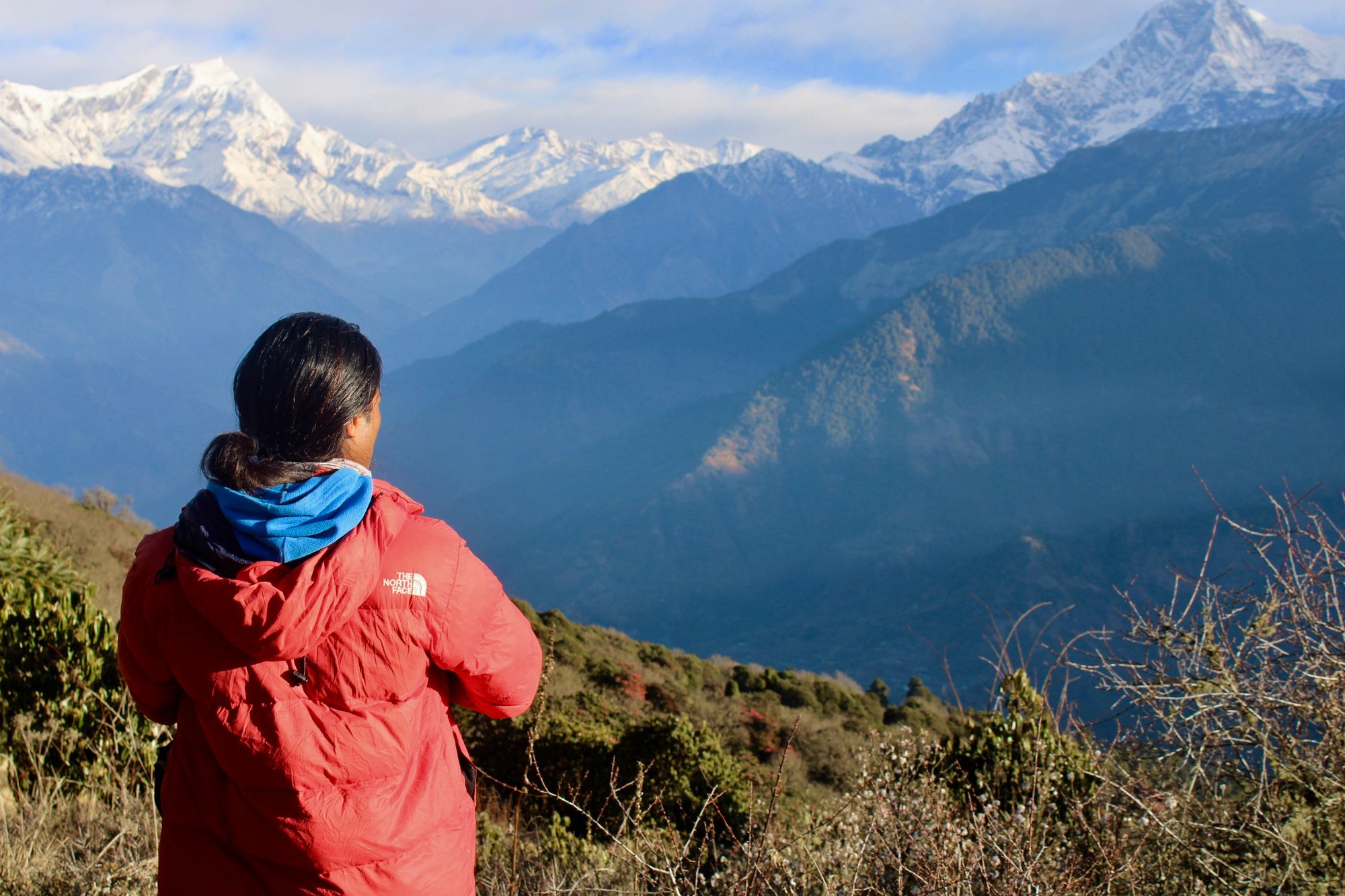 Trekking guide looking out over the Himalayas, Nepal.