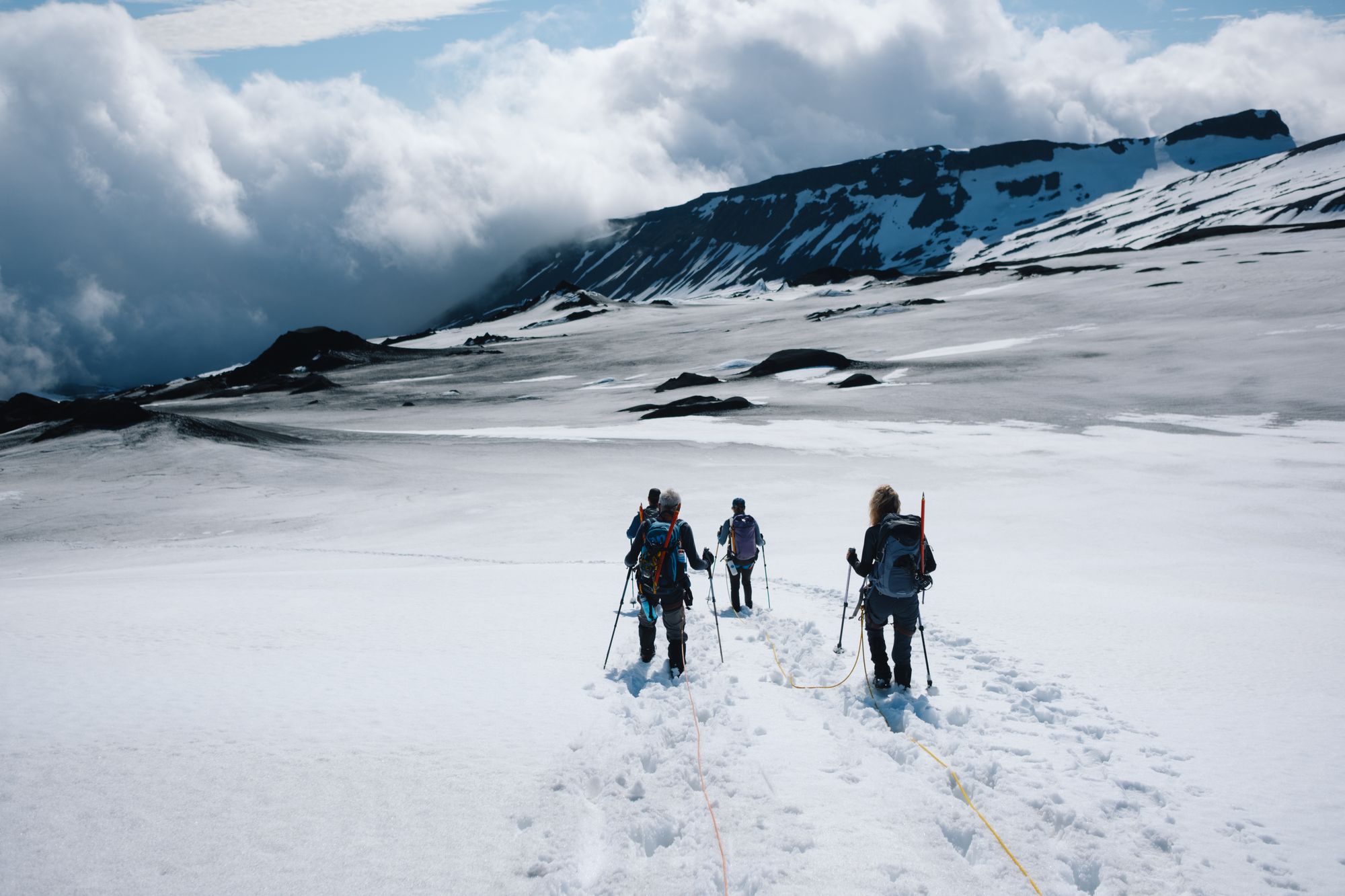 Hikers on a snow-covered mountain in Iceland