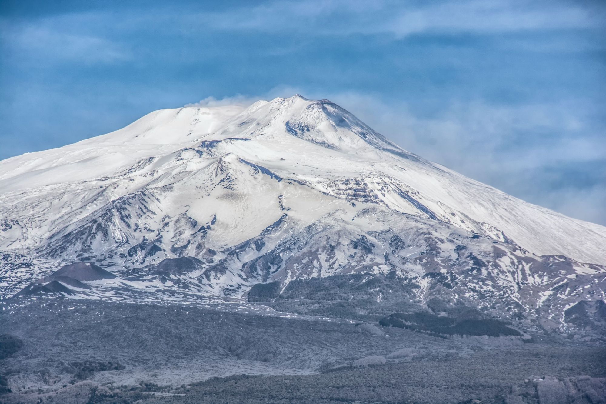 The intimidating landscape of Mount Etna in winter, covered in a thick layer of ice and snow. Photo: Getty