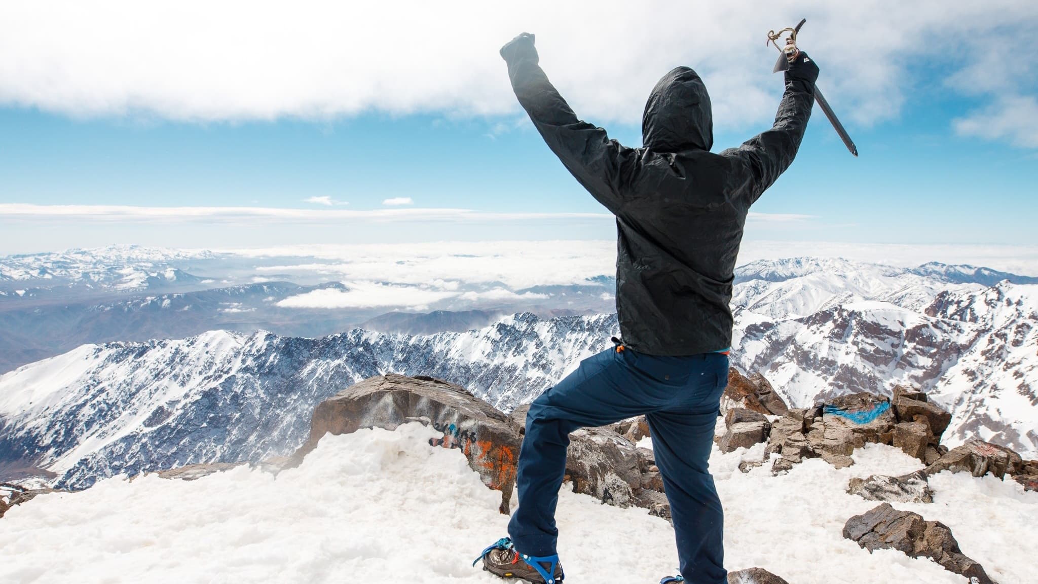 Hiker at the summit of Mount Toubkal, Morocco