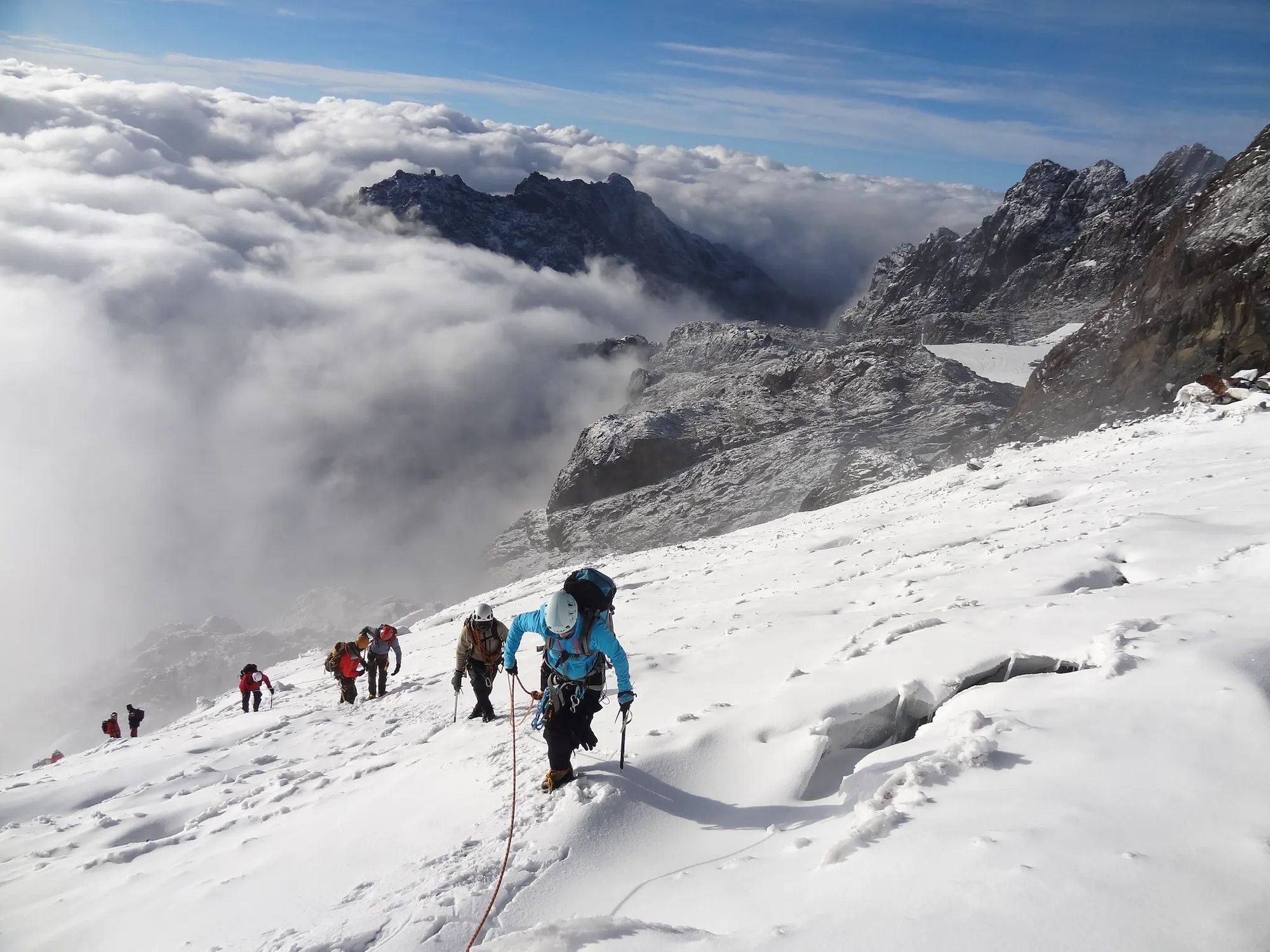 Climbers on the snowy slopes of Margherita Peak, Uganda