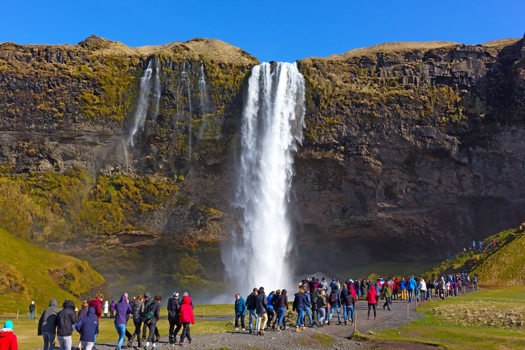 Crowds flock to the Skógafoss waterfall in the south of Iceland. Photo: Getty