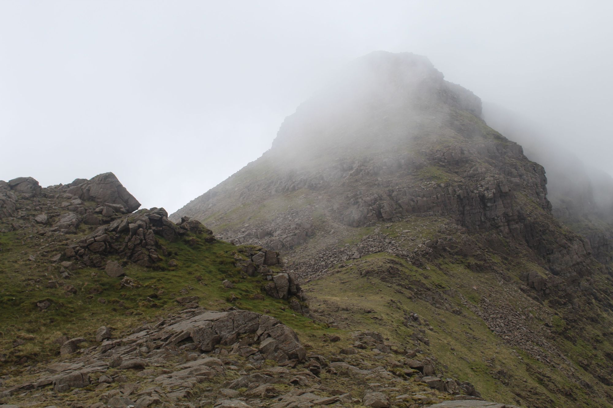 The summit of Hallival retreats into the mist, on the Rùm Cuillin. Photo: Stuart Kenny