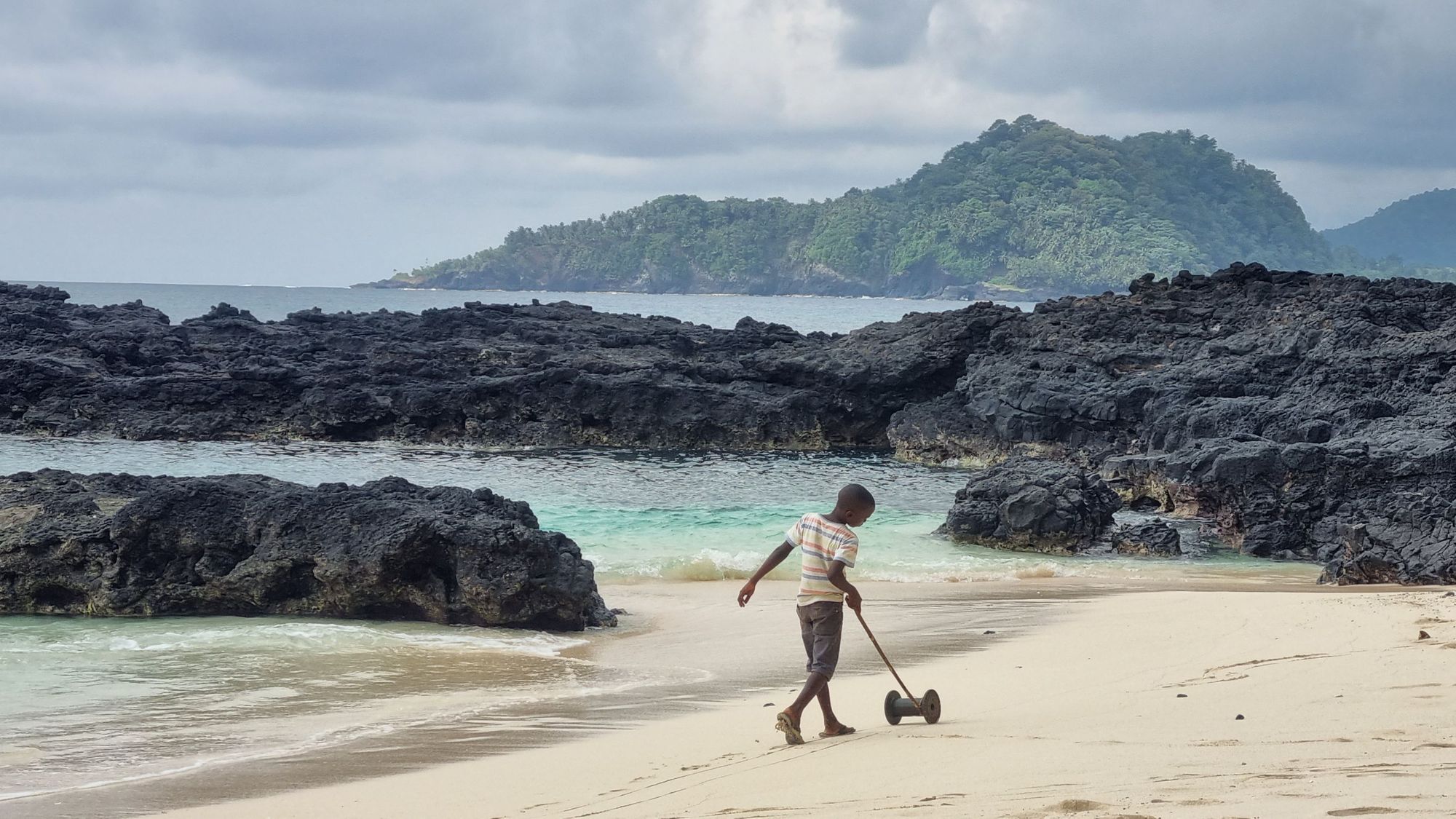 A boy playing on the beach in São Tomé and Príncipe. Photo: Marta Marinelli.