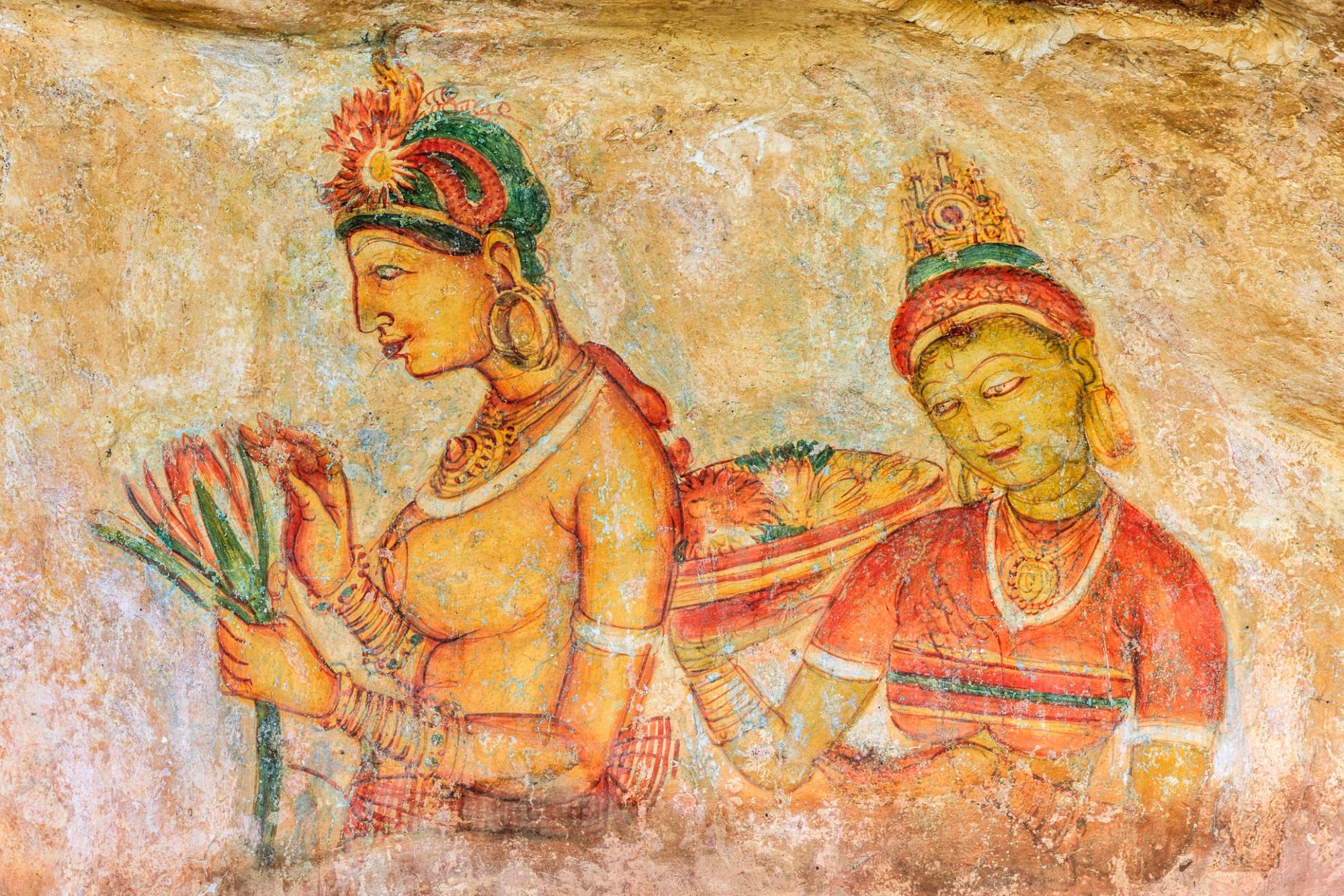 A fragment of the frescoes which once adorned Sigiriya, a sacred site in Sri Lanka. Photo: Getty.